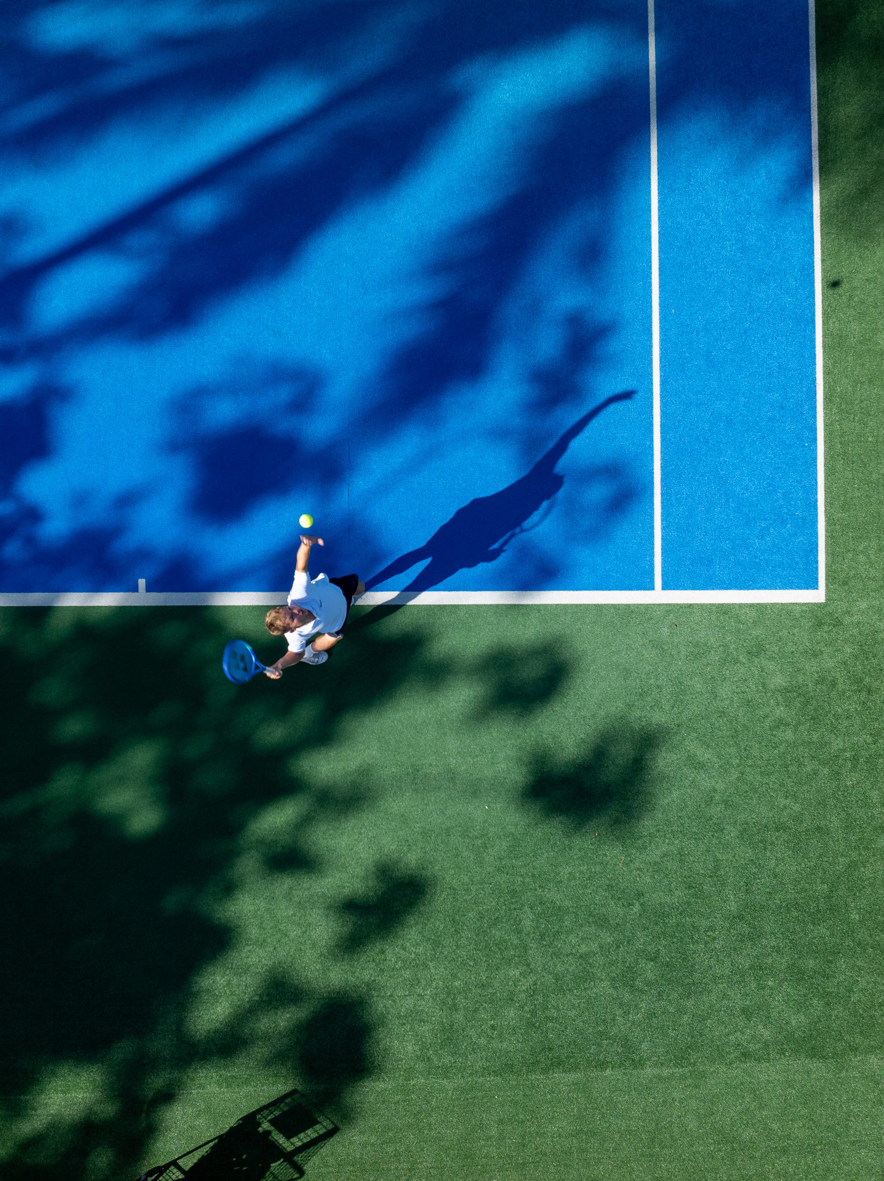 Man playing tennis at hotel