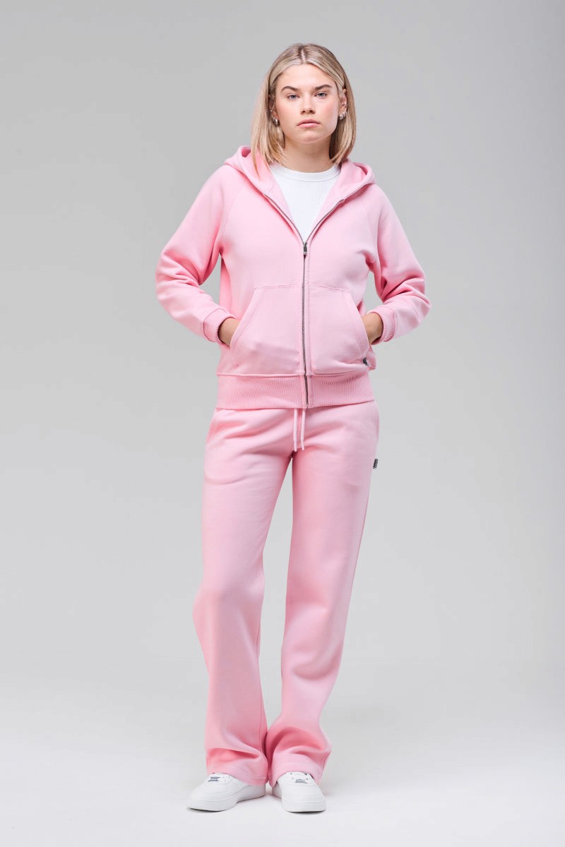 Model wearing pink zip hoodie, full figure front