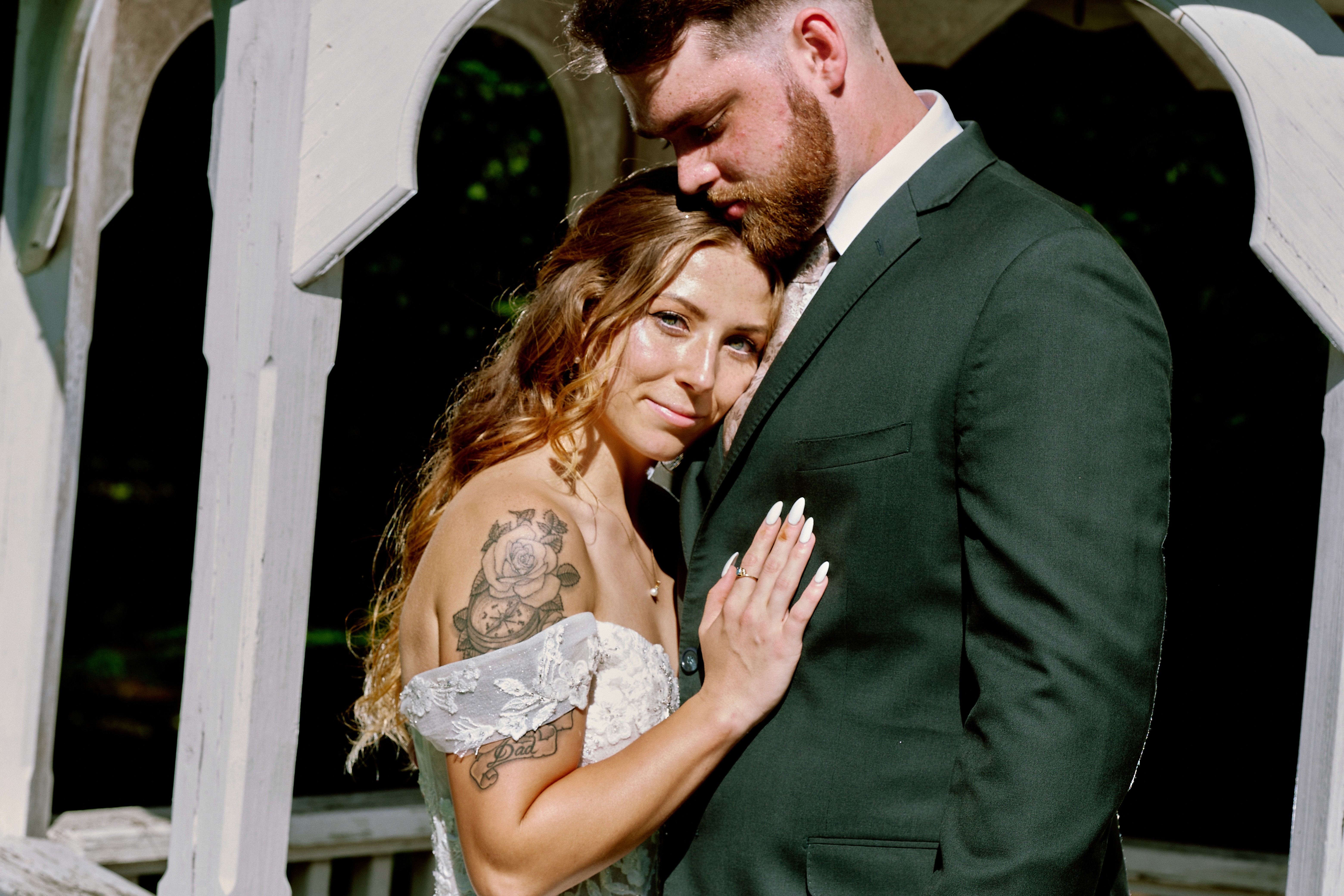 Bride in white dress walking on street, blurred motorcycle passing