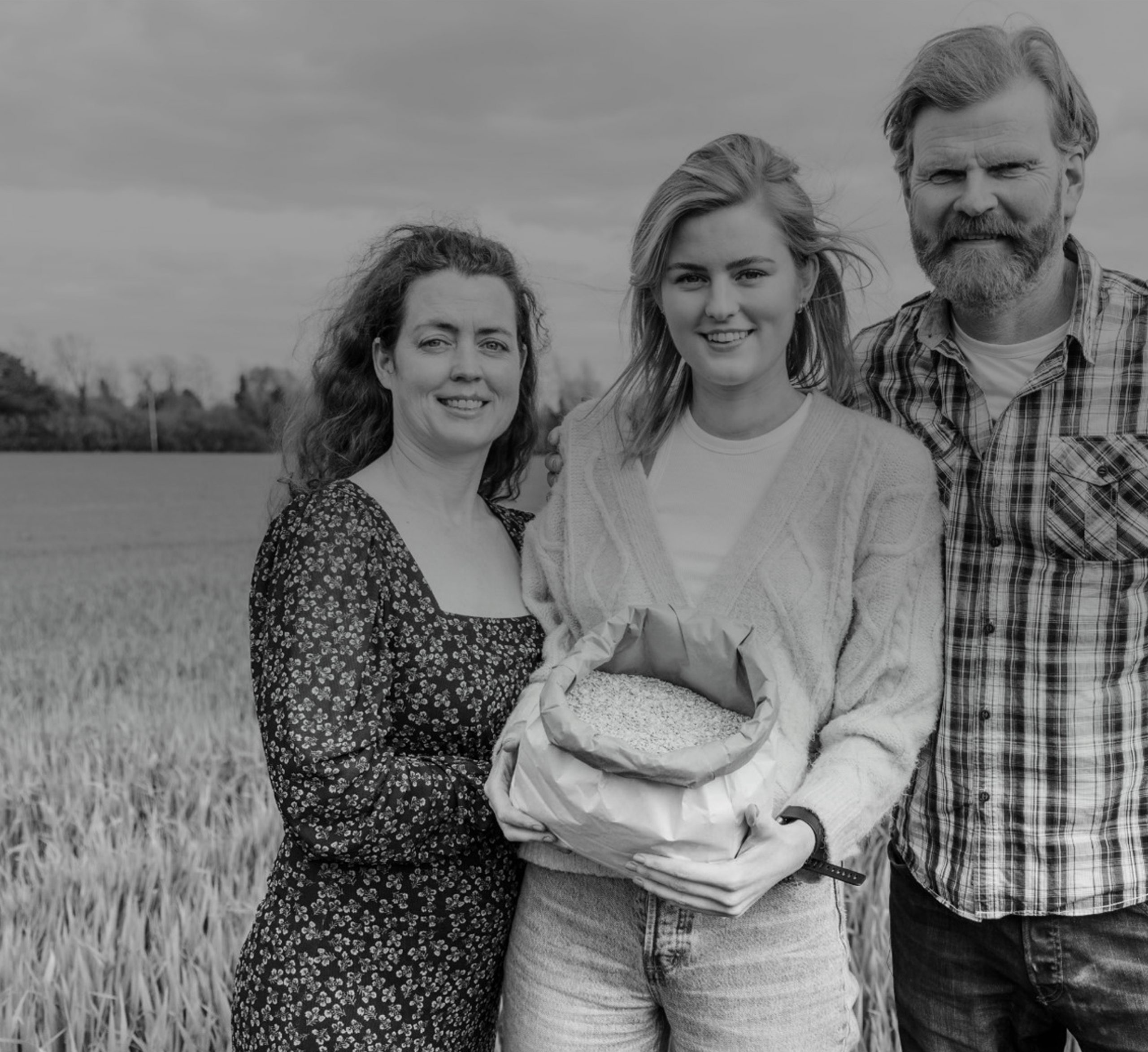 Owners of The Merry Mill showing their food while being in a field, laughing while supplying their goods to As One Restaurant Dubliln
