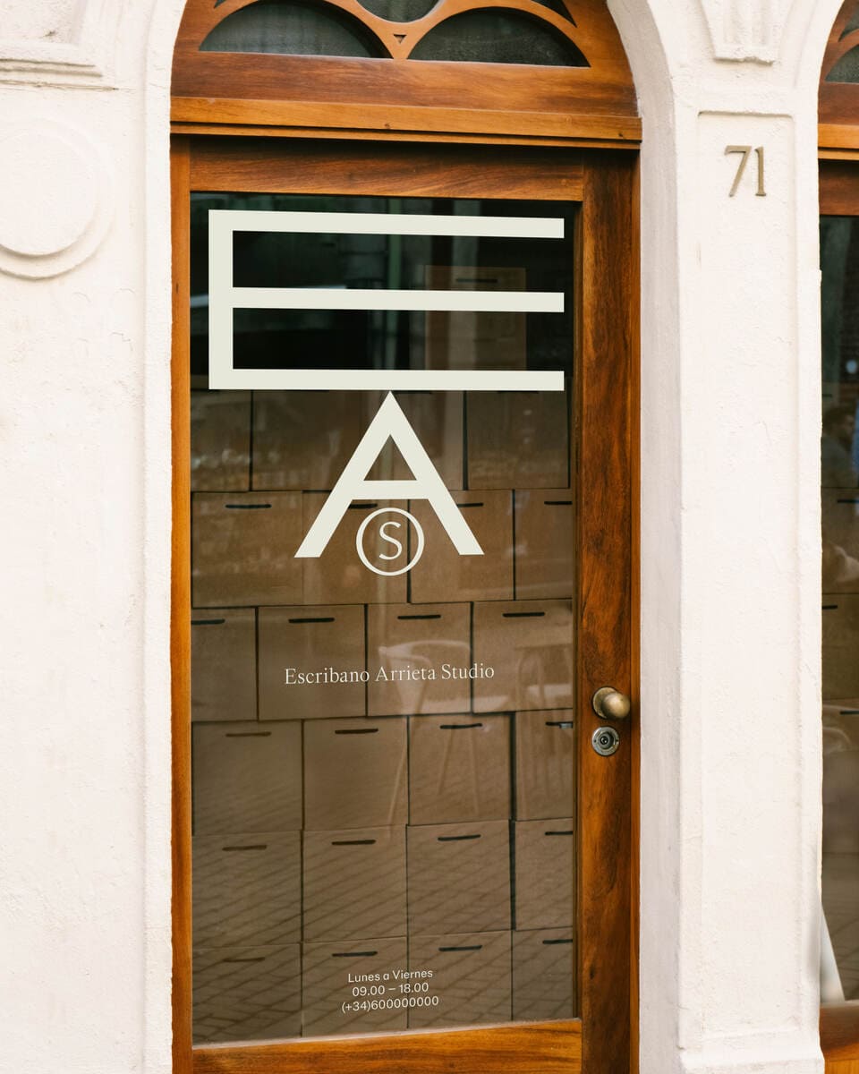 A vinyl of EAS logo in a glass door.