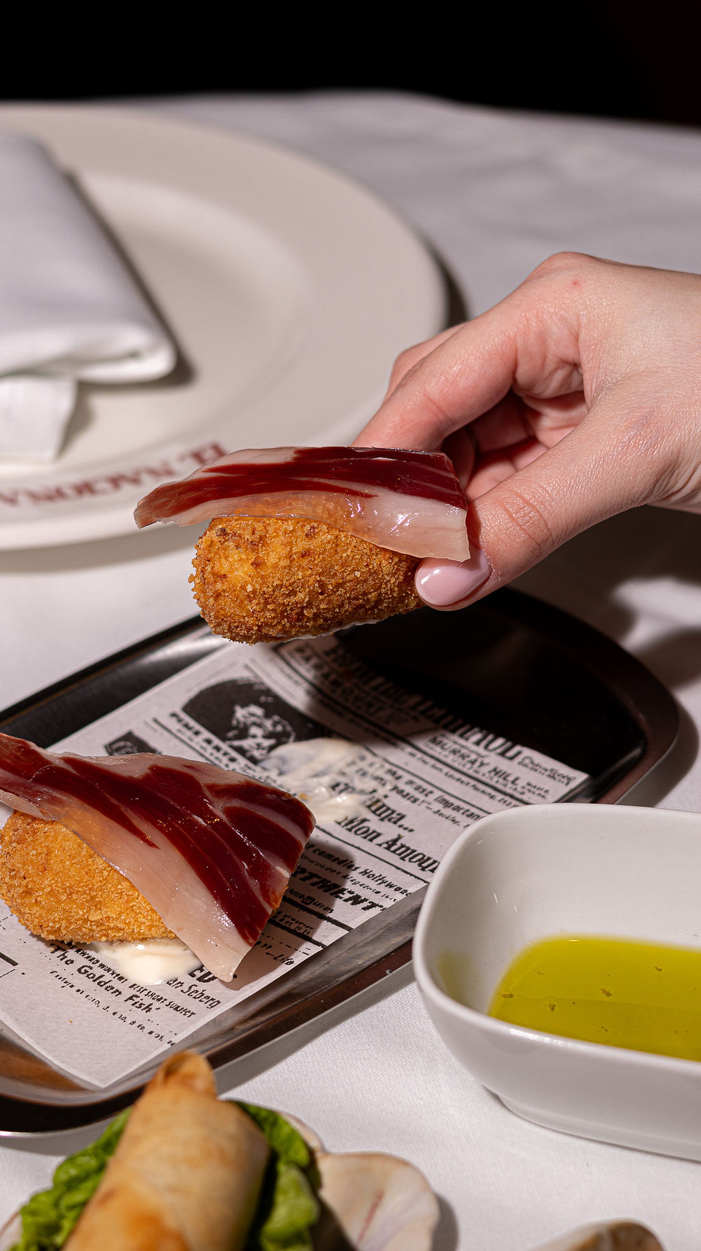 Bottles of olive standing on the marble counter