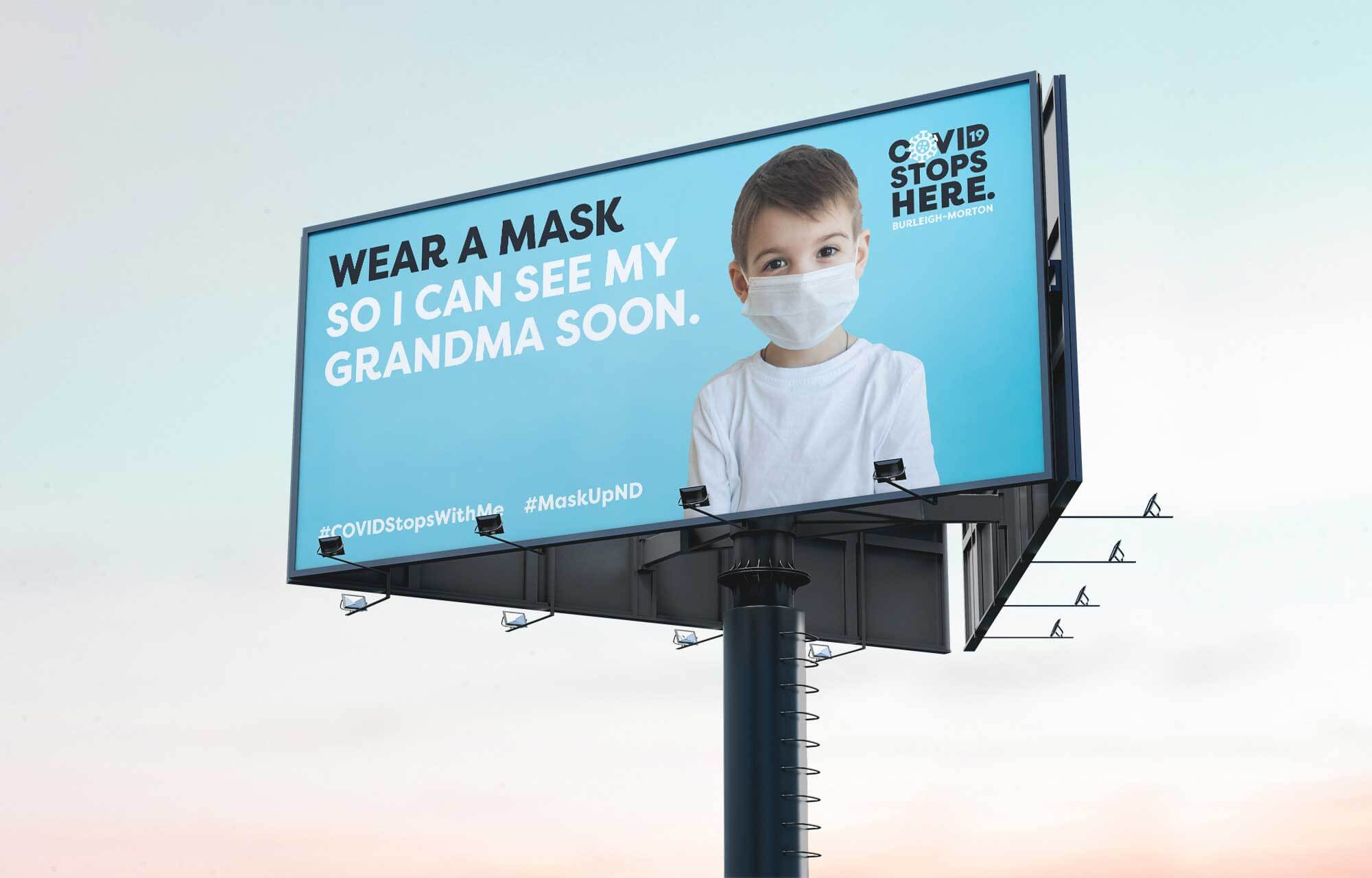 COVID stops here billboard