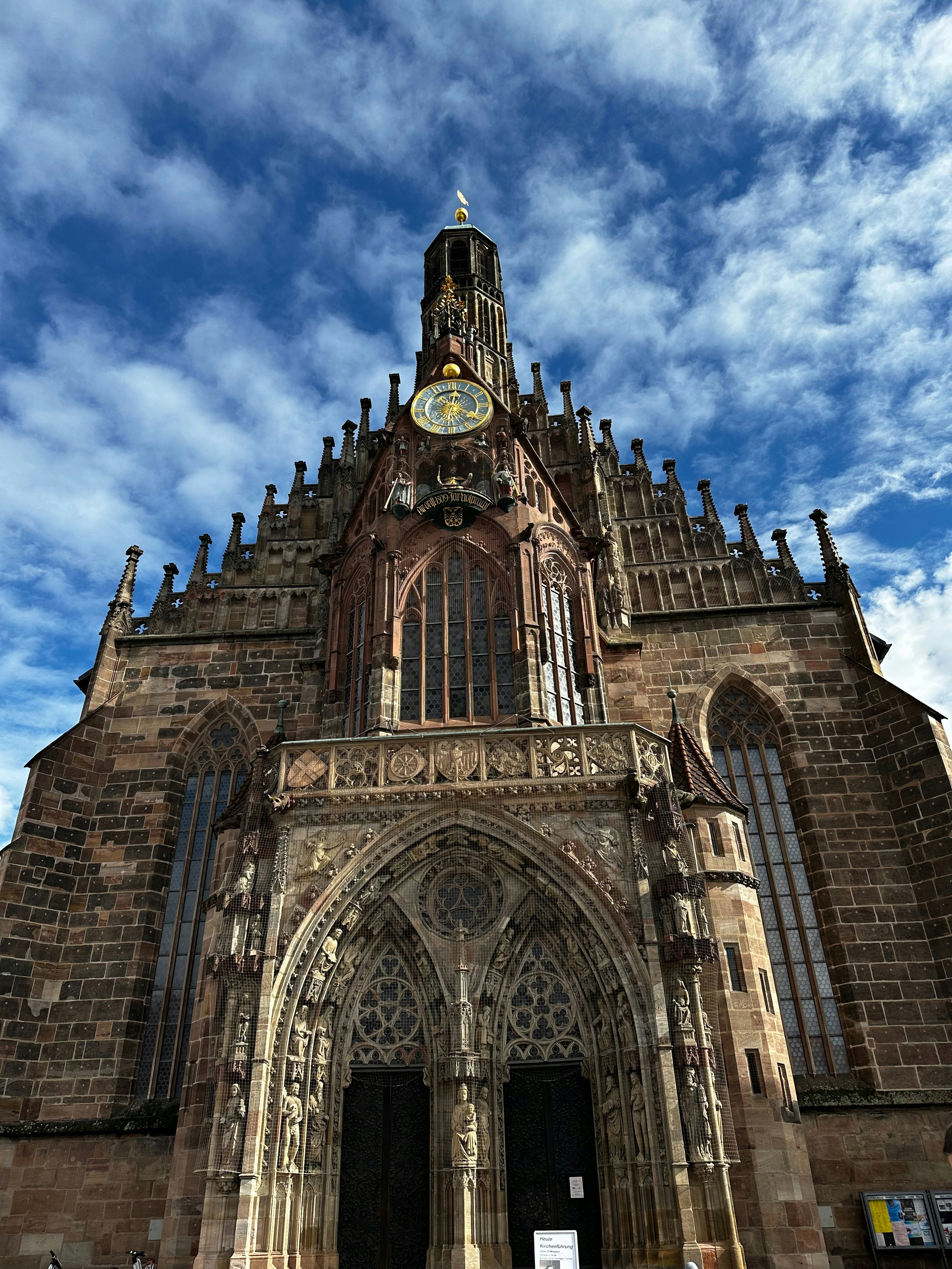 a very tall building with a clock on it's side