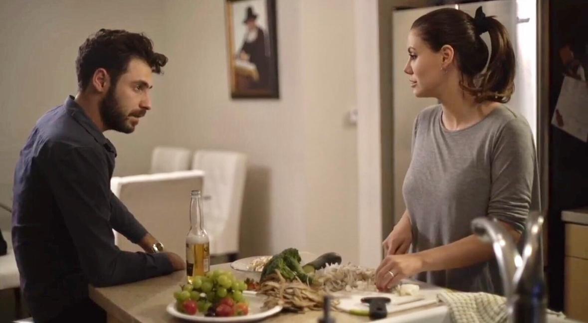 a woman holding a red flower