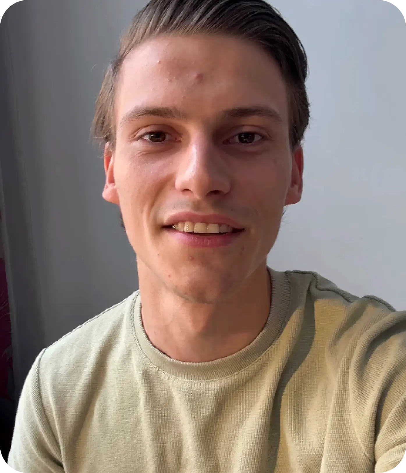 man standing beside wall