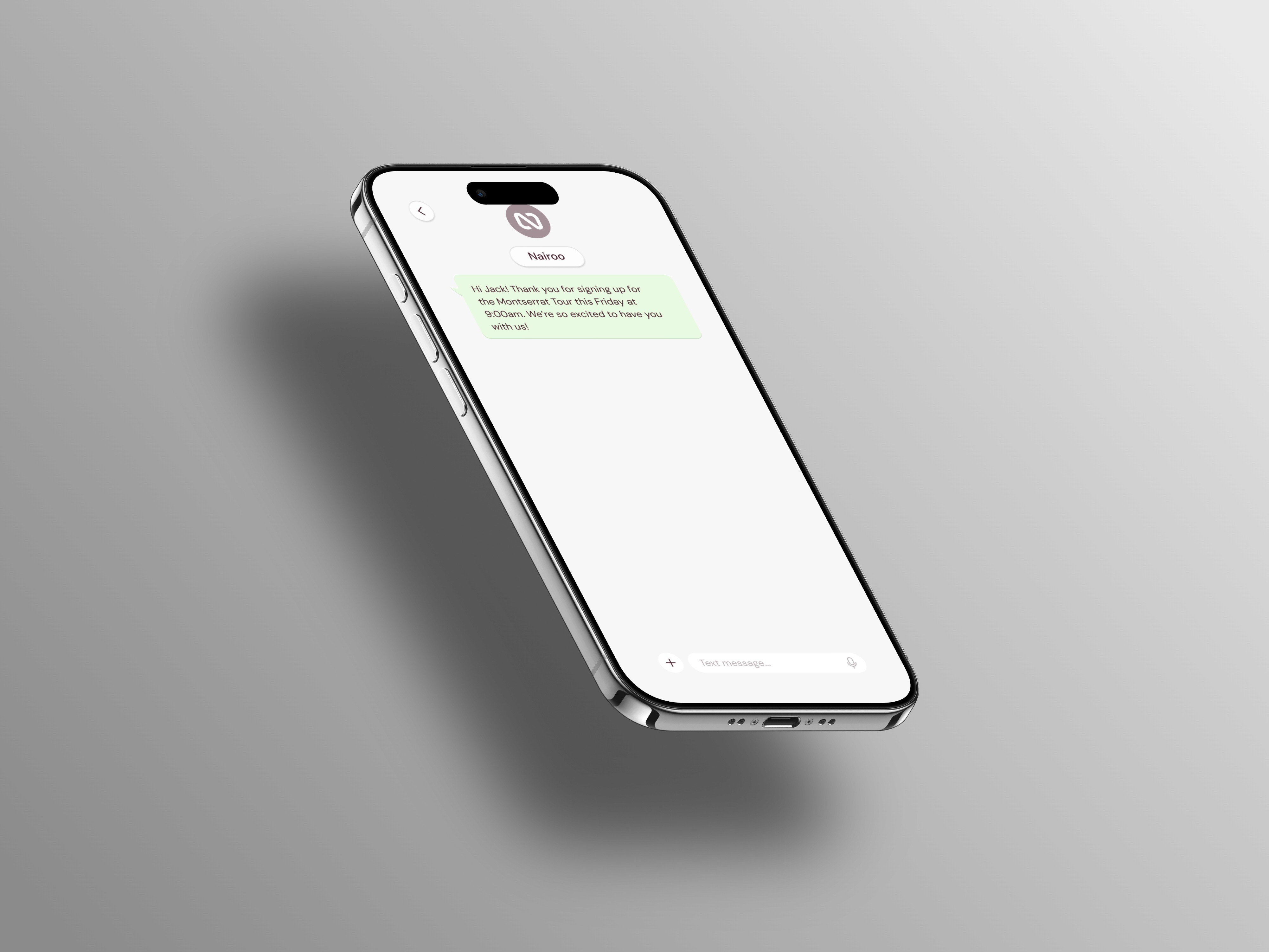 Hand holding a minimalist spray bottle with a green label and bold white typography, releasing a single soap bubble against a black background.