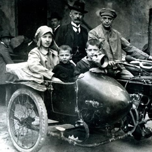 Ancient photo of a family in a sidecar