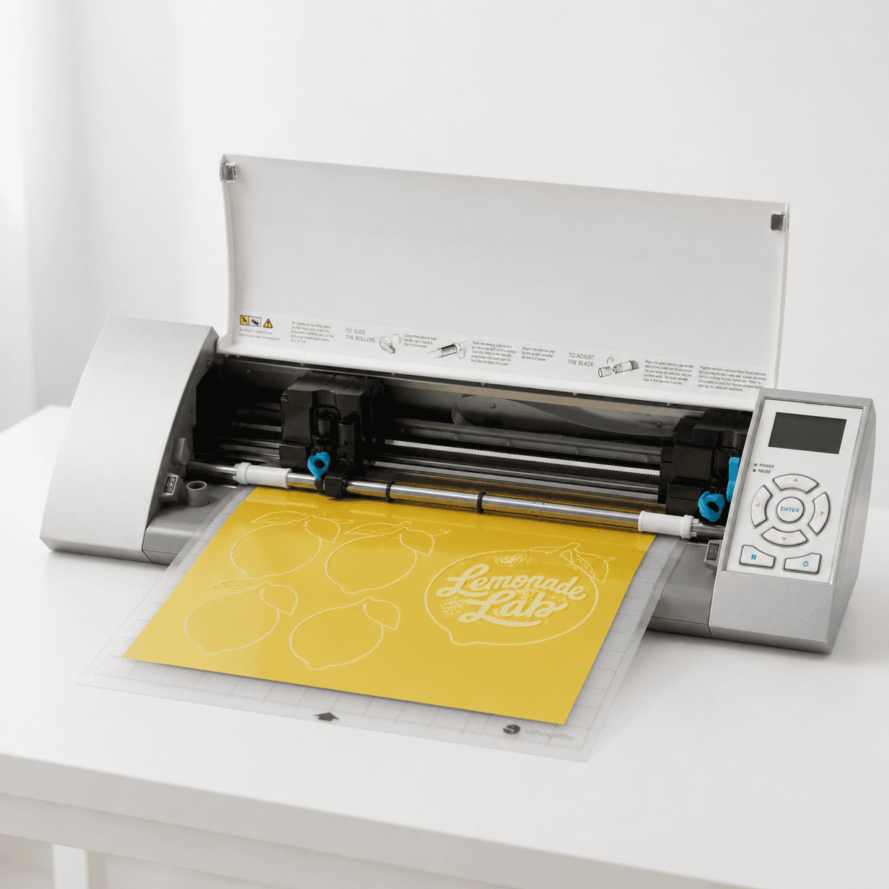 Silhouette Cameo digital cutter used for stickers, signs, and packaging.