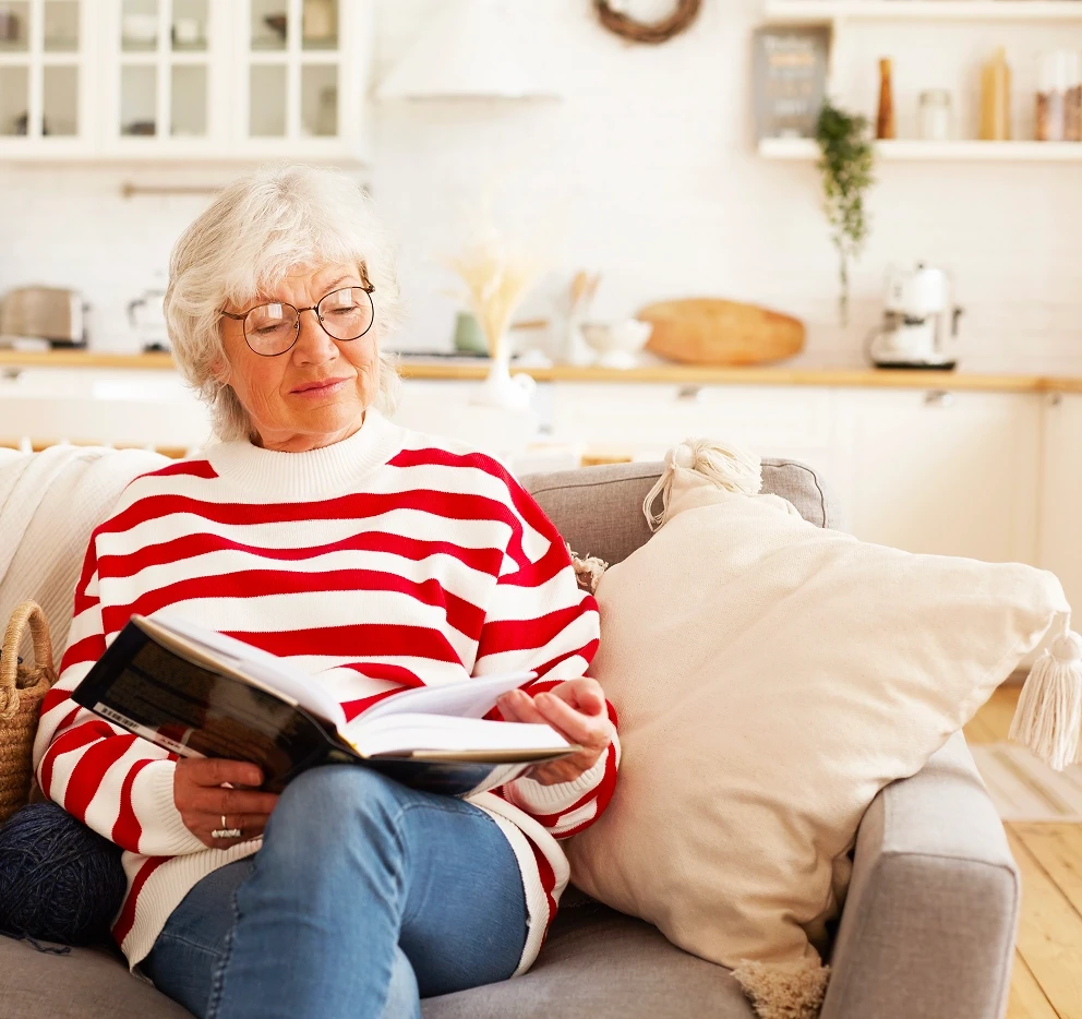 elderly woman sitting at home