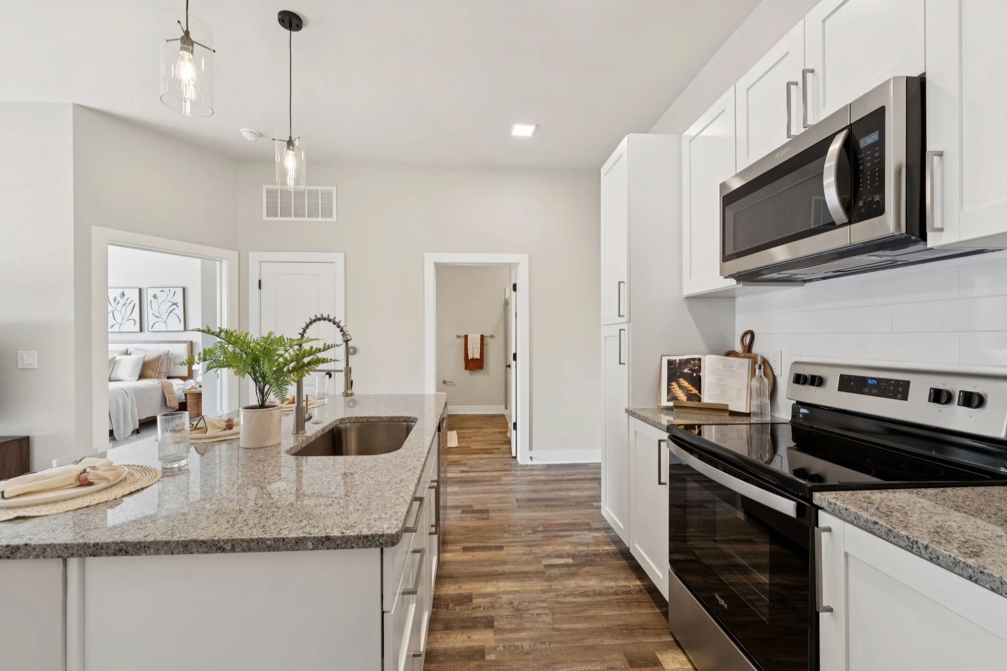 A stylish kitchen with sleek stainless steel appliances and polished granite countertops.