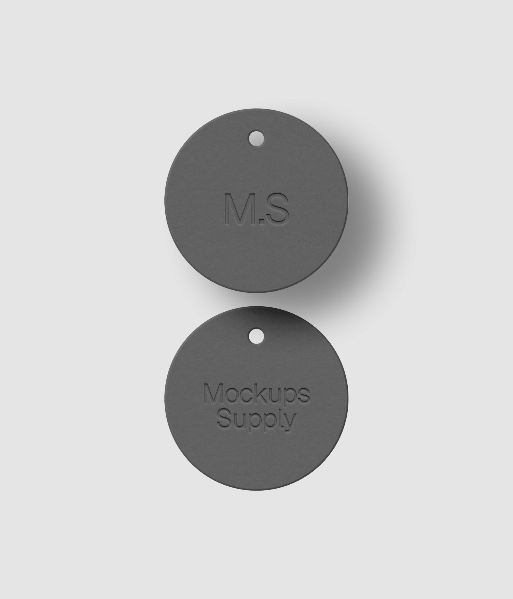 Circular white paper hang tag mockup showing embossed text typography with soft shadow for brand identity design