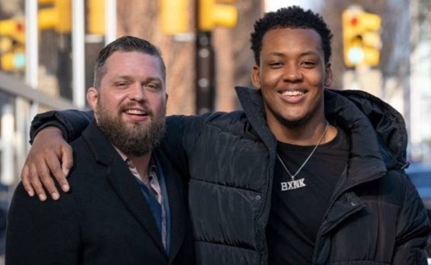 Man stands with Youth Male