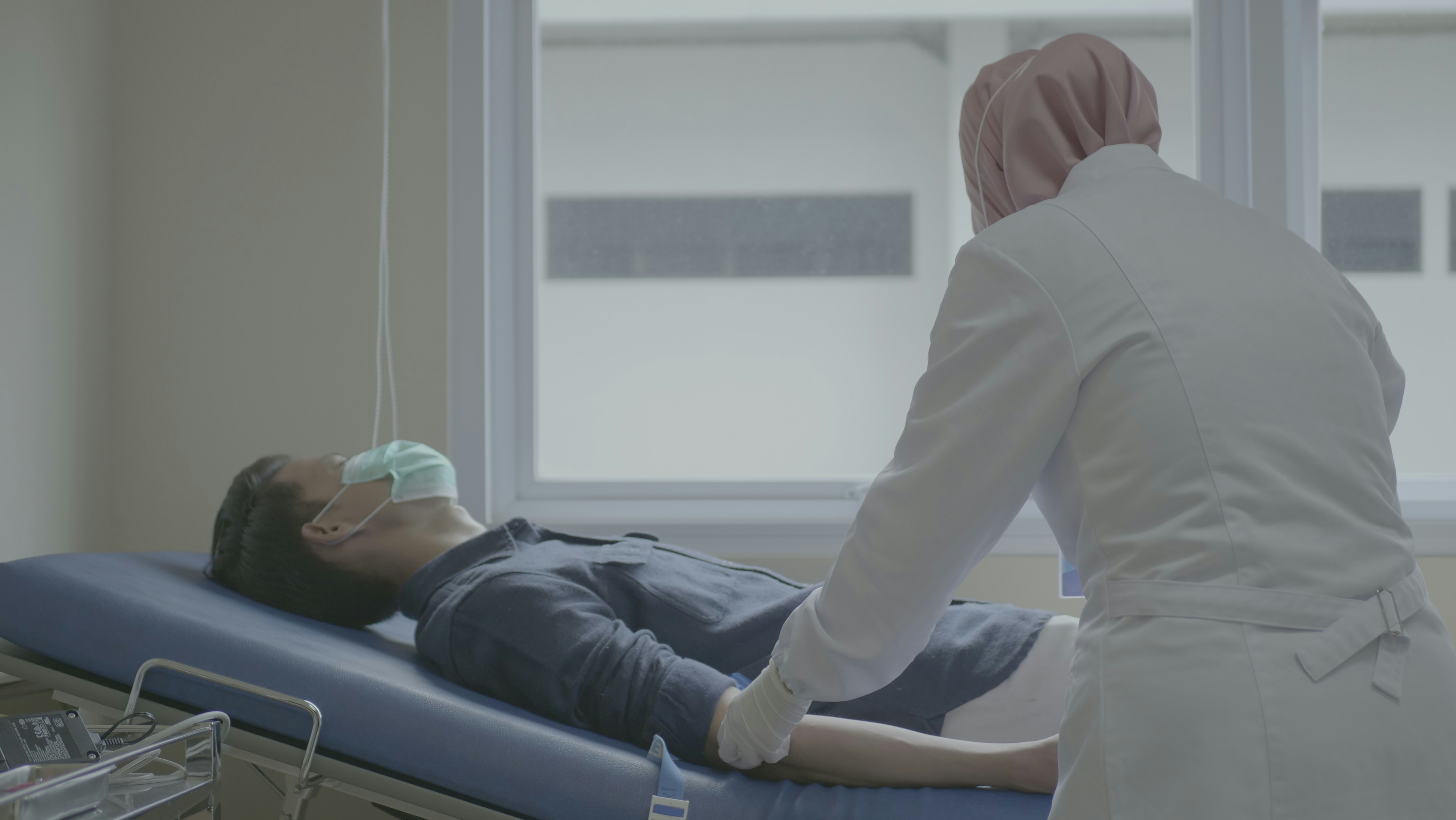 friendly female pediatrician touches shoulder teenage