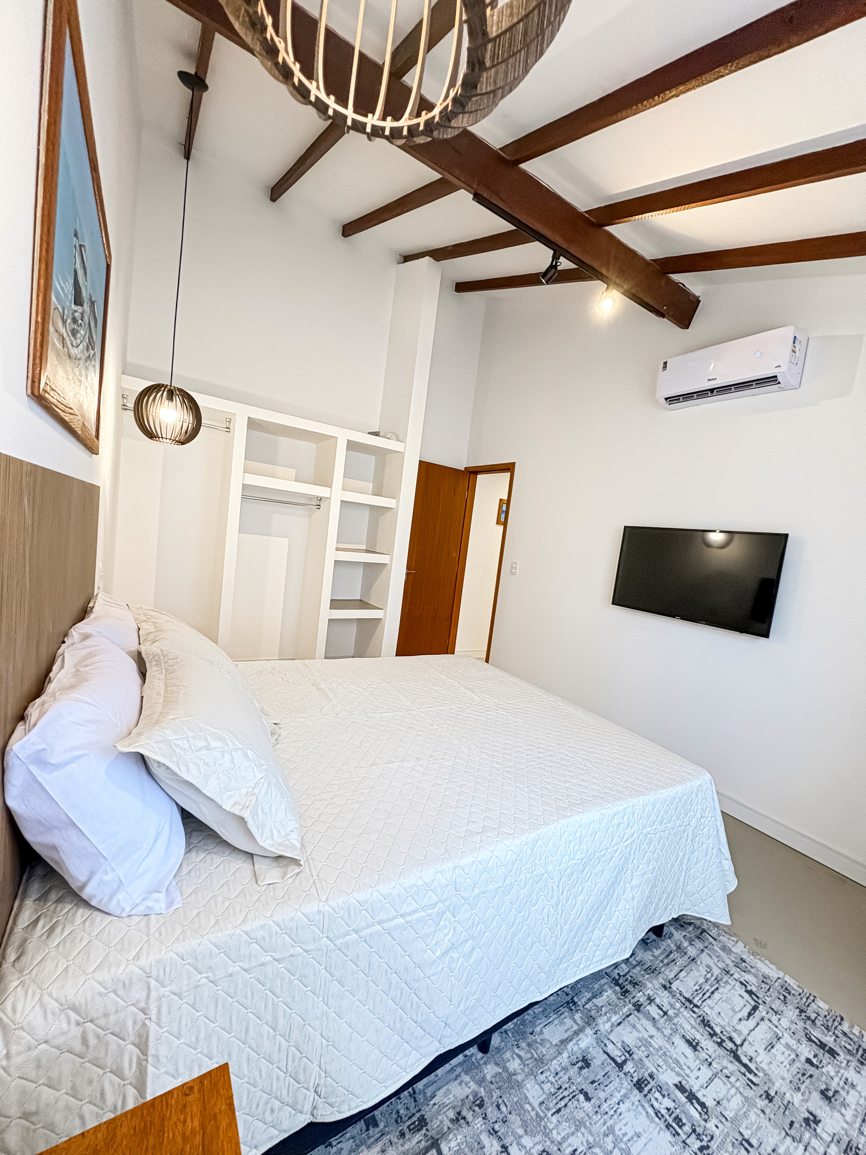 Evening shot with ambient lighting, soft uplighting from behind the bed platform