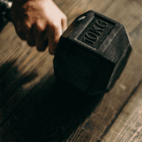 A hand holding a dumbbell