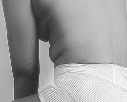 a woman sitting on a chair with her legs crossed