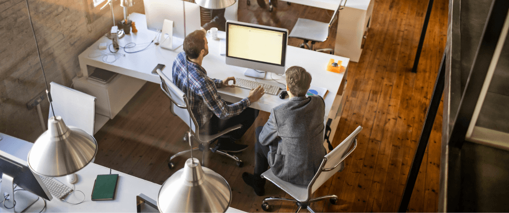 Colleagues looking at a computer screen