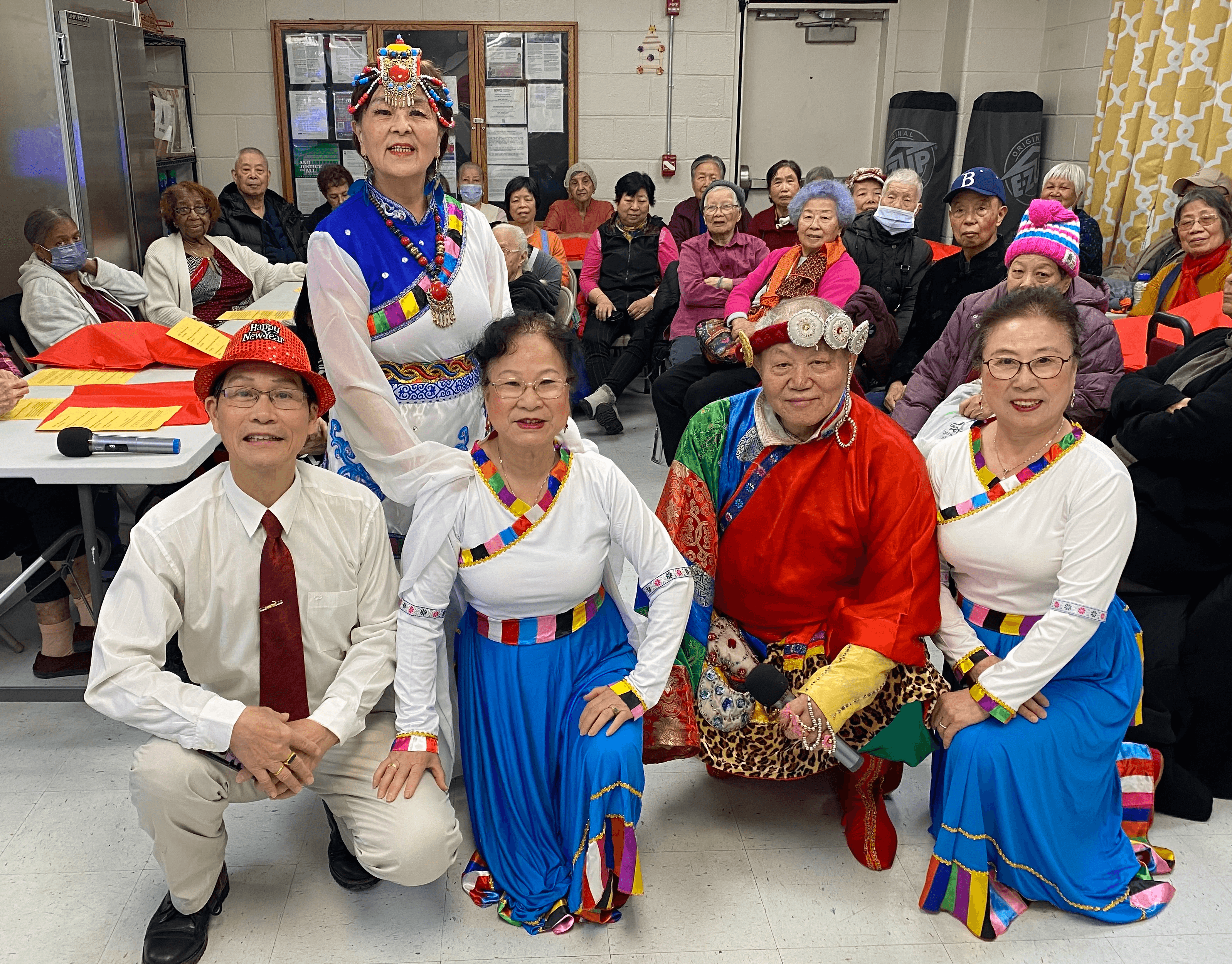 Performers in traditional Chinese dress pose at the Seniors Lunar New Year event.