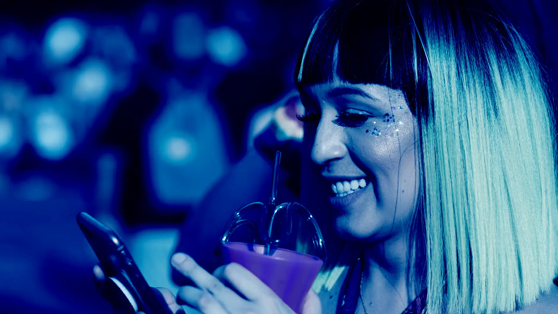 Person using a smartphone at an event, representing the Covatic data platform