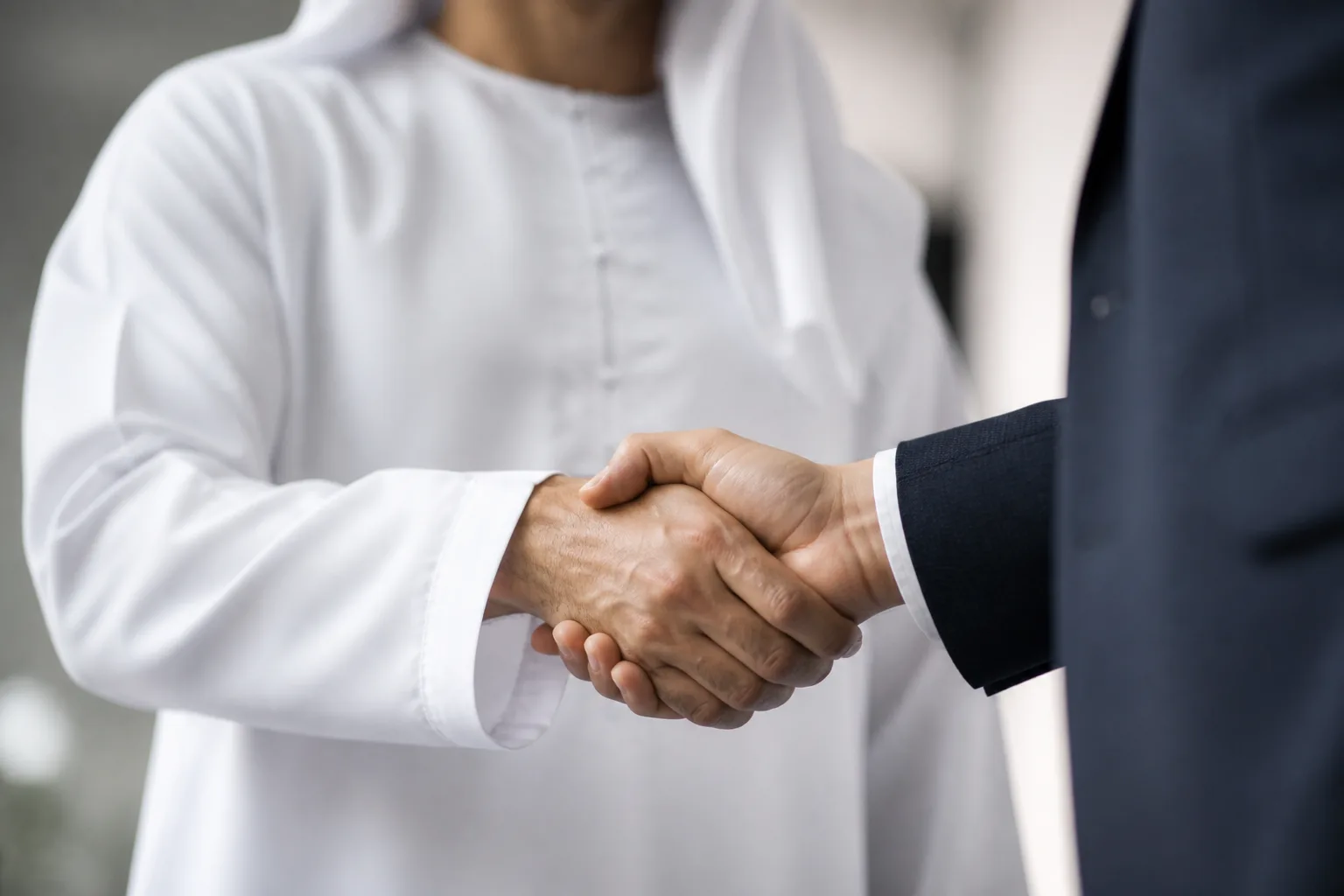 Hiring Your First Employee in Dubai beside an HR dashboard with an employee list and