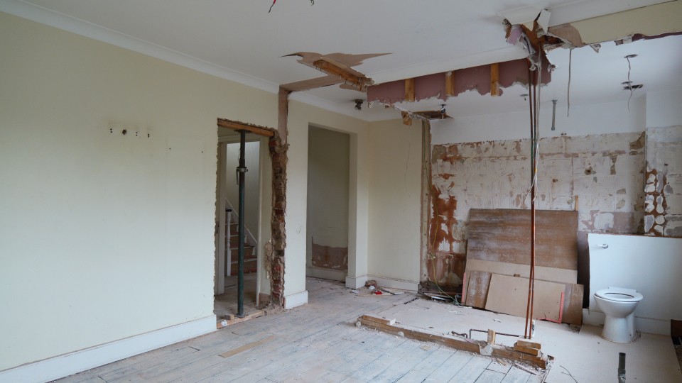 HMO refurbishment showing stripped ceiling, exposed services and room preparation