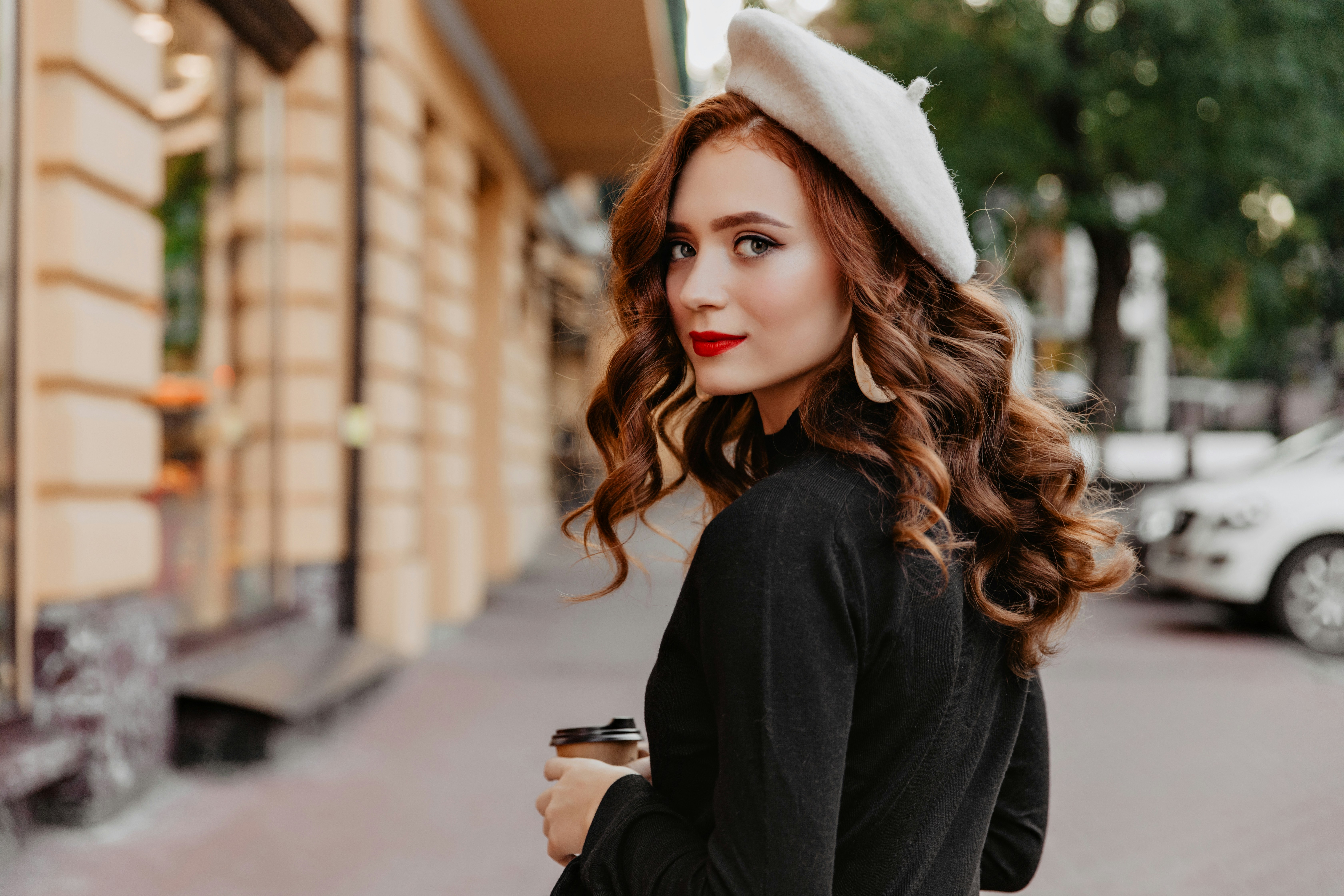 woman walking with a hat - French Skincare Routine