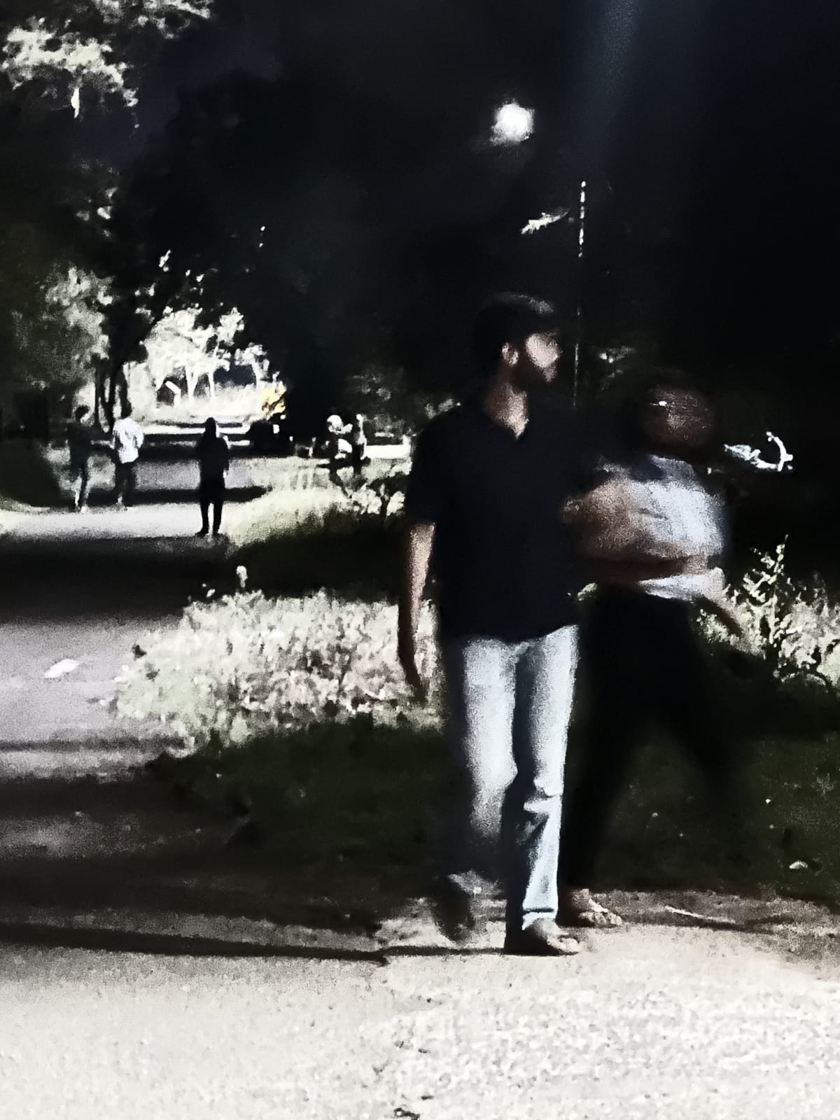 a blurry photo of a person standing in front of a wall