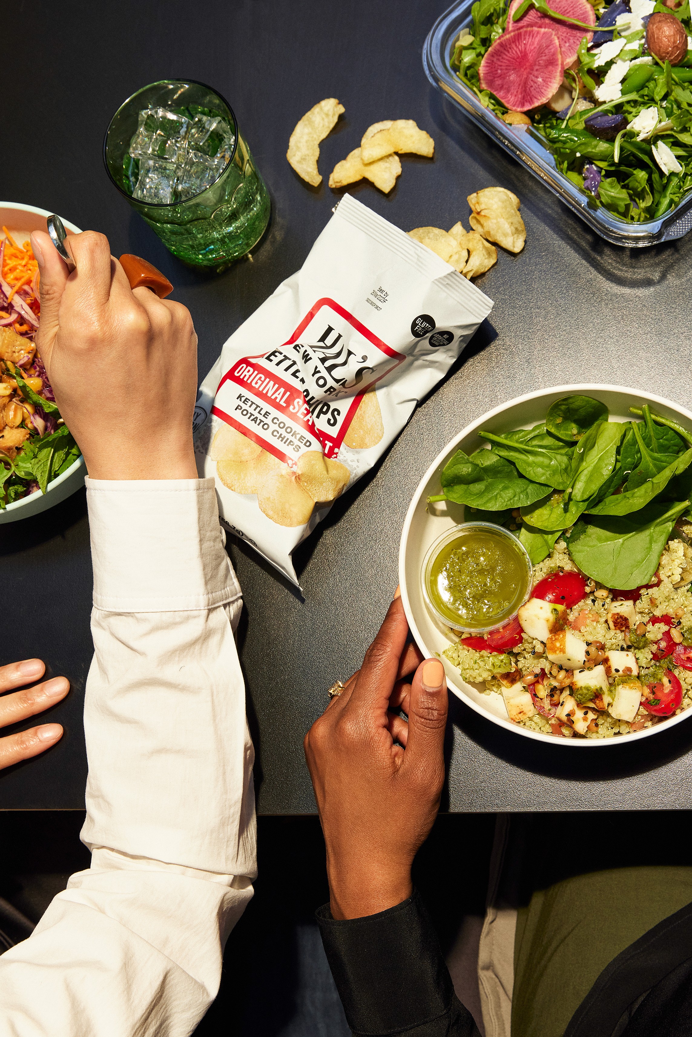 Streetside billboard with flyposters of the Batch.Works brand and illustrations