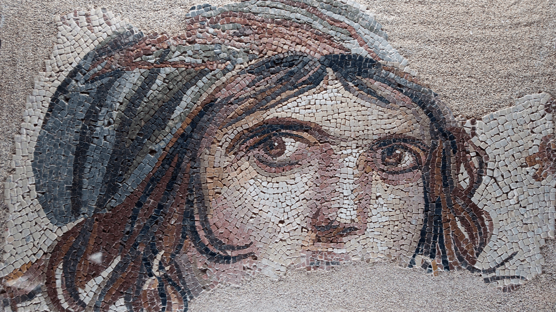 Ancient Roman mosaic artwork displayed at the Zeugma Mosaic Museum in Gaziantep, detailed historical portrait made from colorful stone tiles