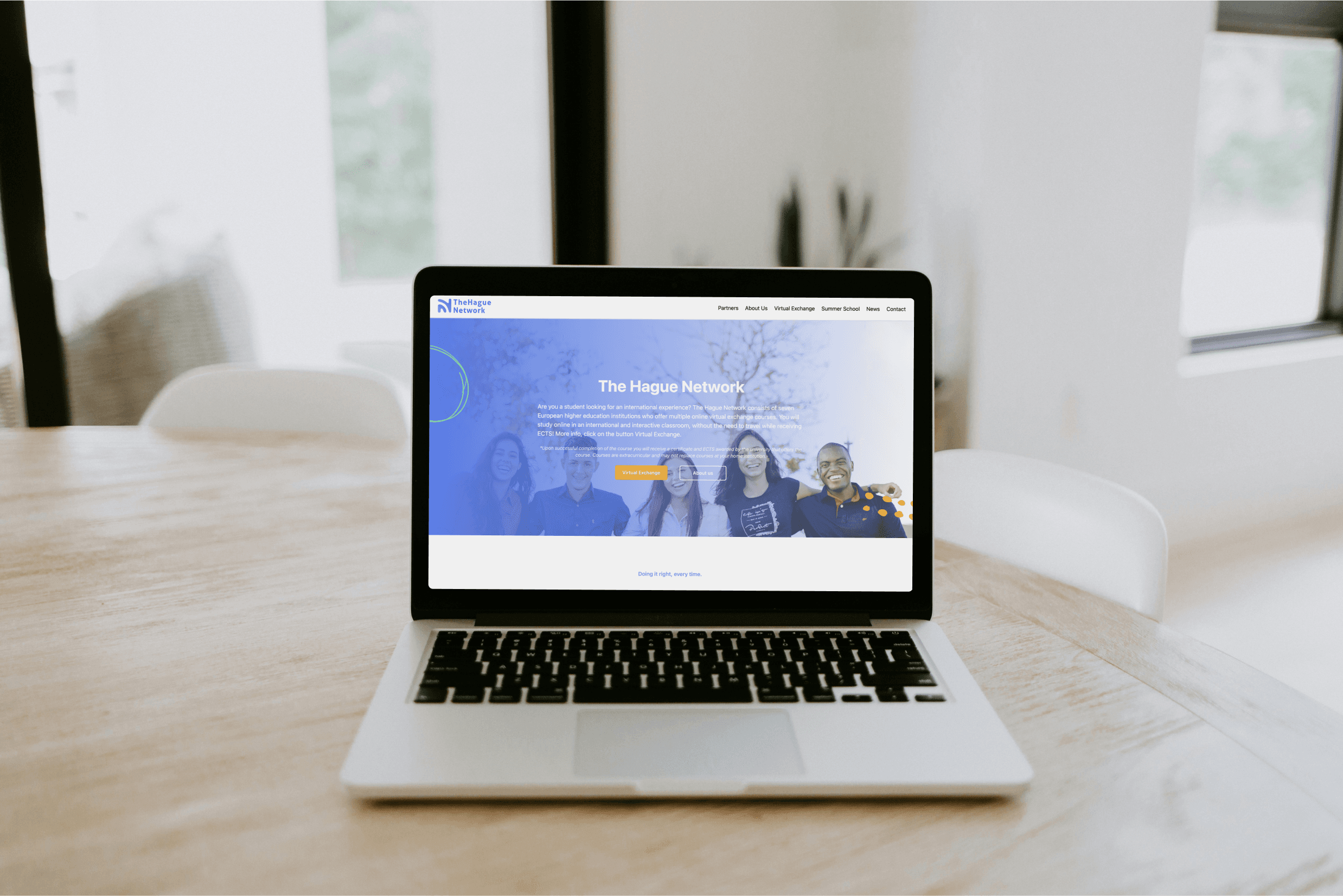 A mockup for a Macbook placed on a table for a hair salon website