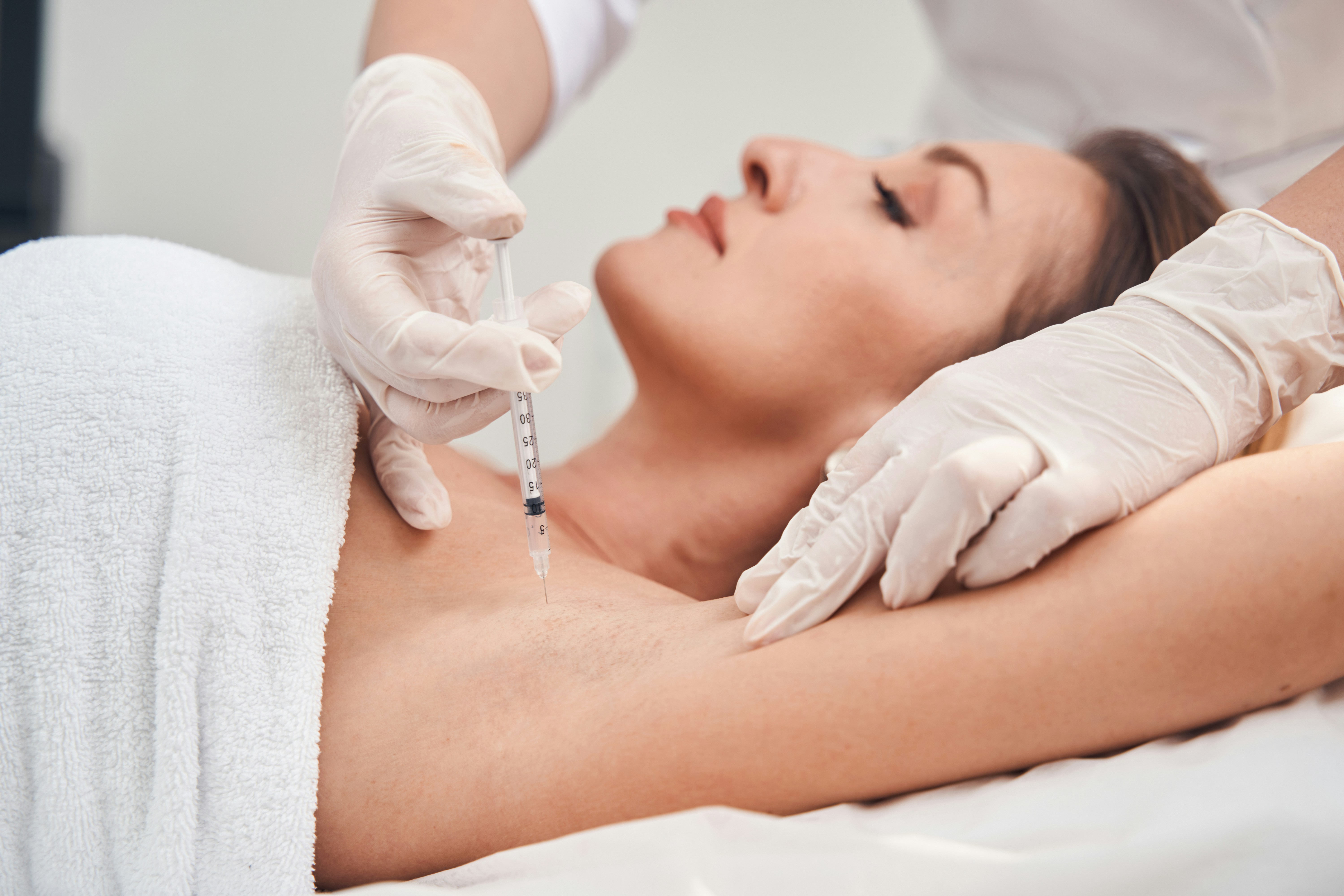 Medical aesthetic practitioner preparing for professional cosmetic procedure