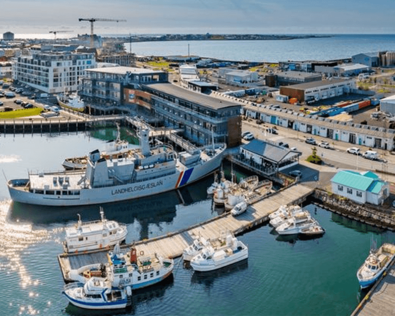 Aerial view of the Grandi District in Reykjavík, Iceland, showing the Old Harbour, docked boats, and waterfront buildings—one of the top areas for things to do in Reykjavik with attractions, museums, and restaurants.