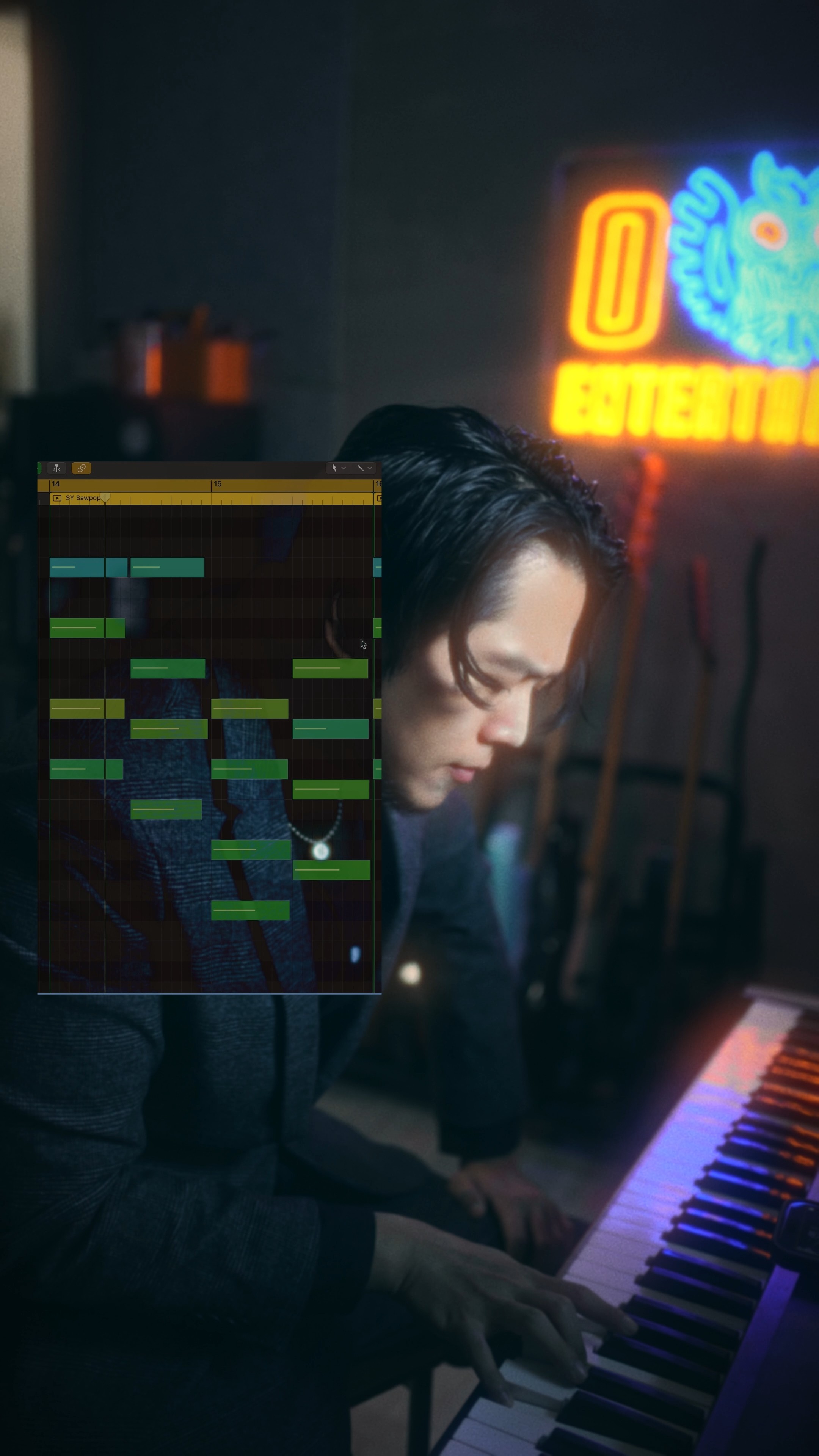 A person holding a camera is silhouetted against vivid orange stage lights. The scene conveys focus and creativity with a dramatic, moody atmosphere.