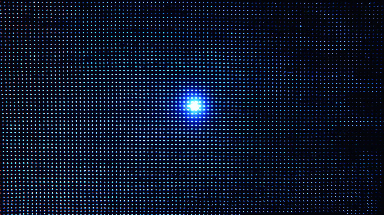 A woman wearing a futuristic helmet illuminated with neon blue and orange lights.