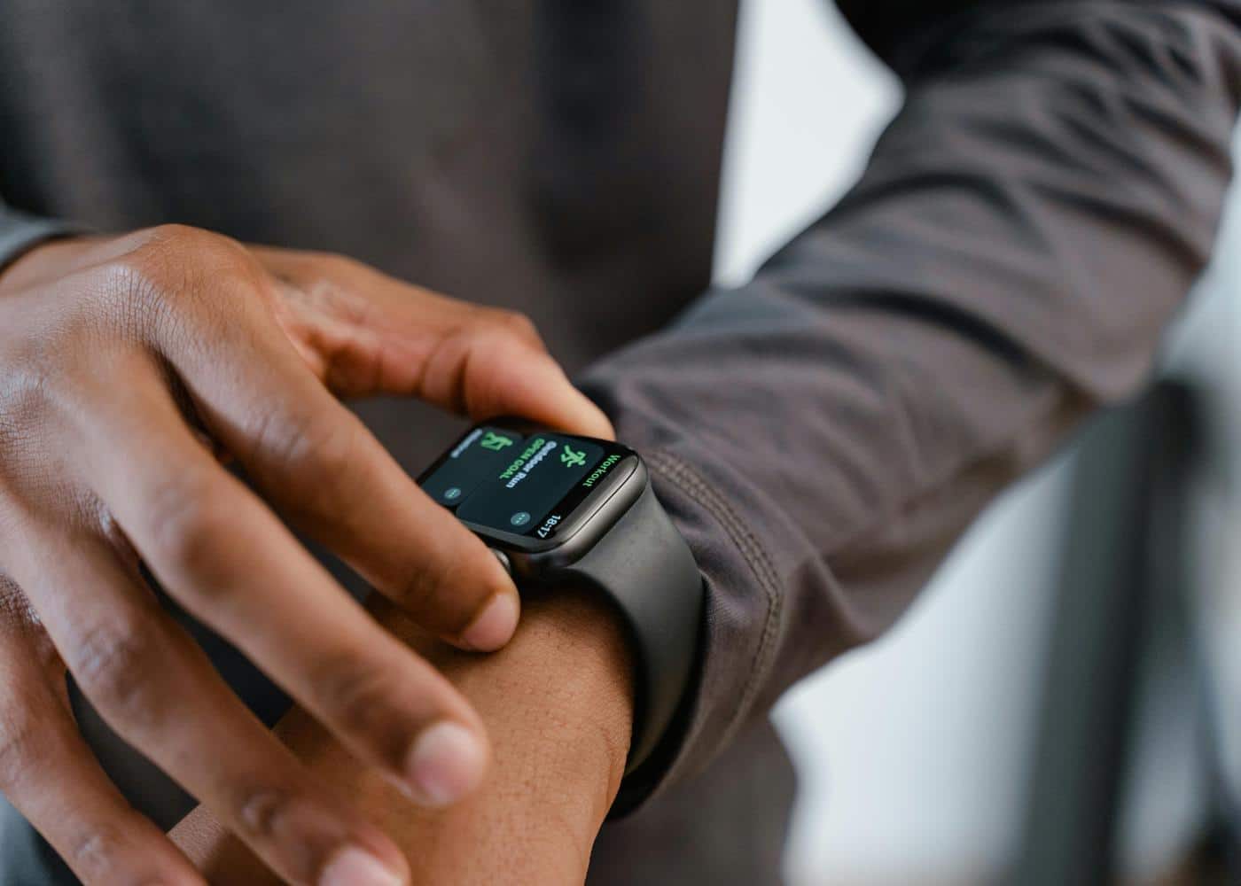 Man checking his quantified health metrics on a smartwatch