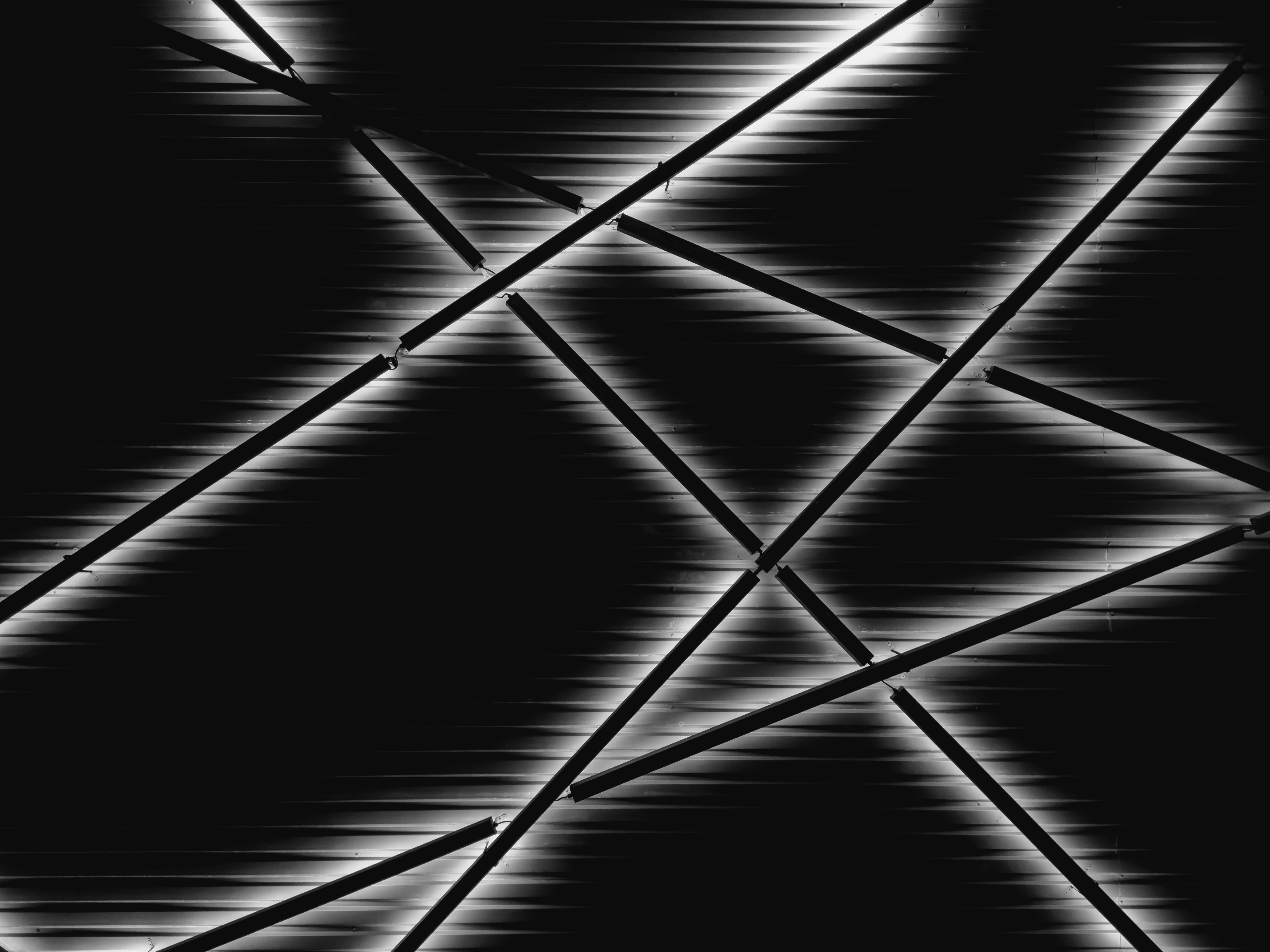 Abstract black background with glowing white lines