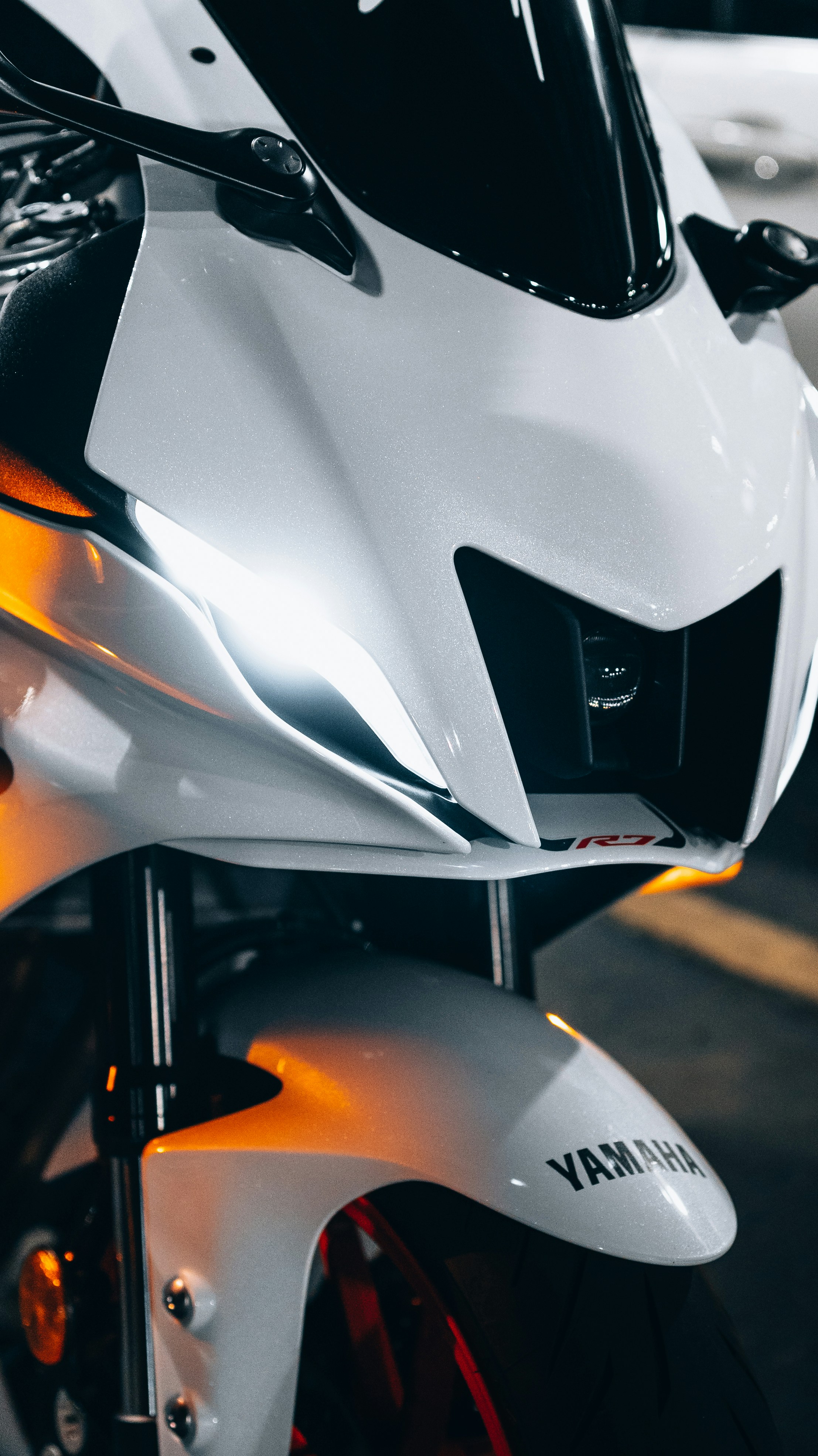 a close up of a white and black motorcycle
