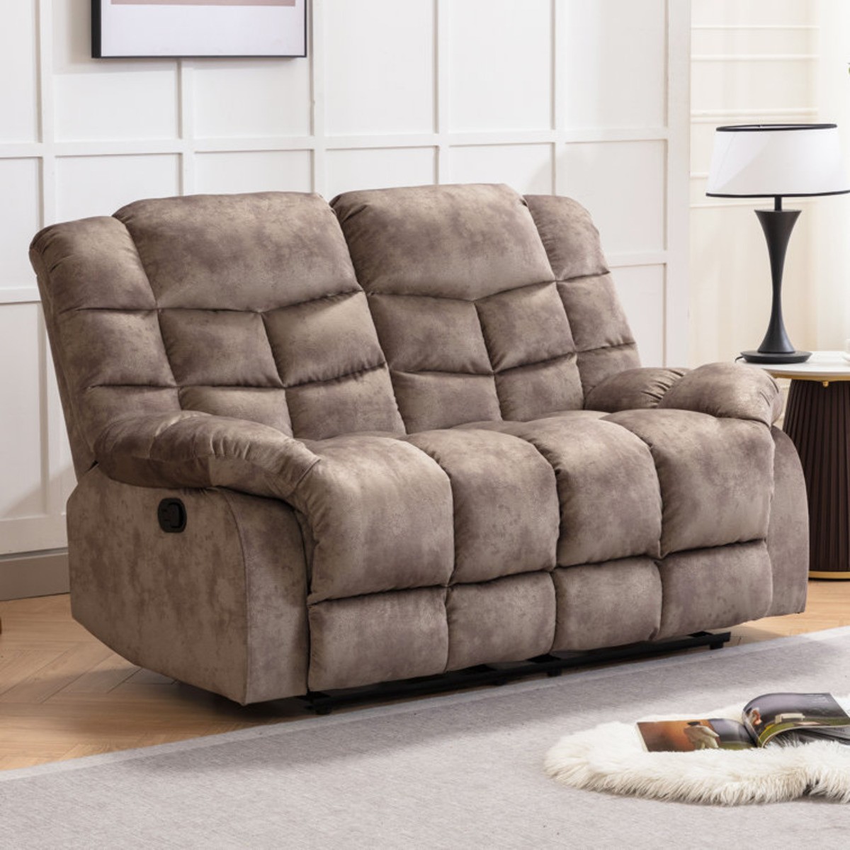 Manual reclining loveseat next to a circular end table with lamp.