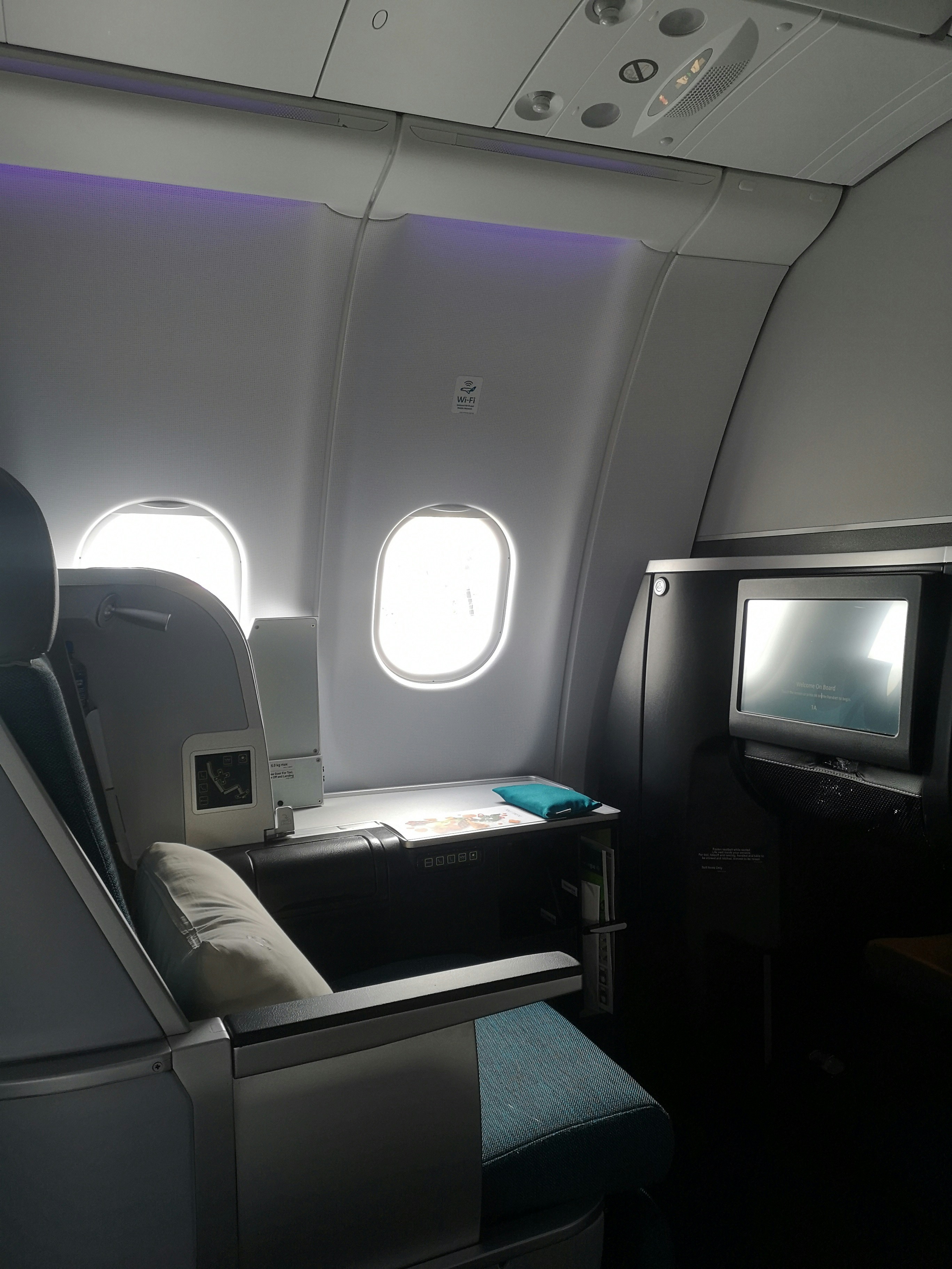 the inside of an airplane with a flat screen tv