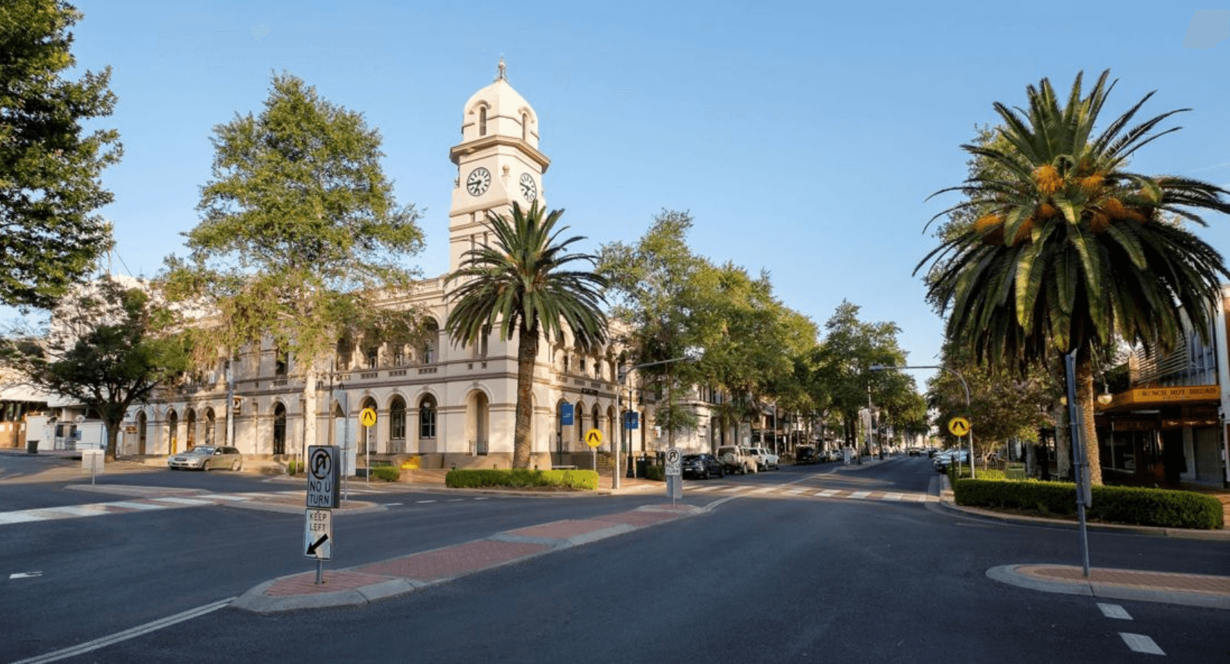 Street with classic building and clock tower.
