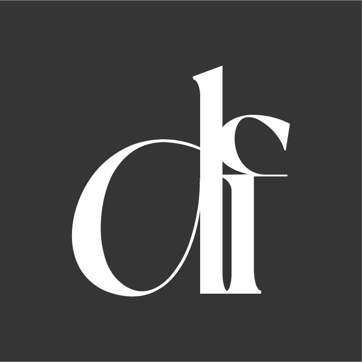 Profile portrait of a man in a grey shirt