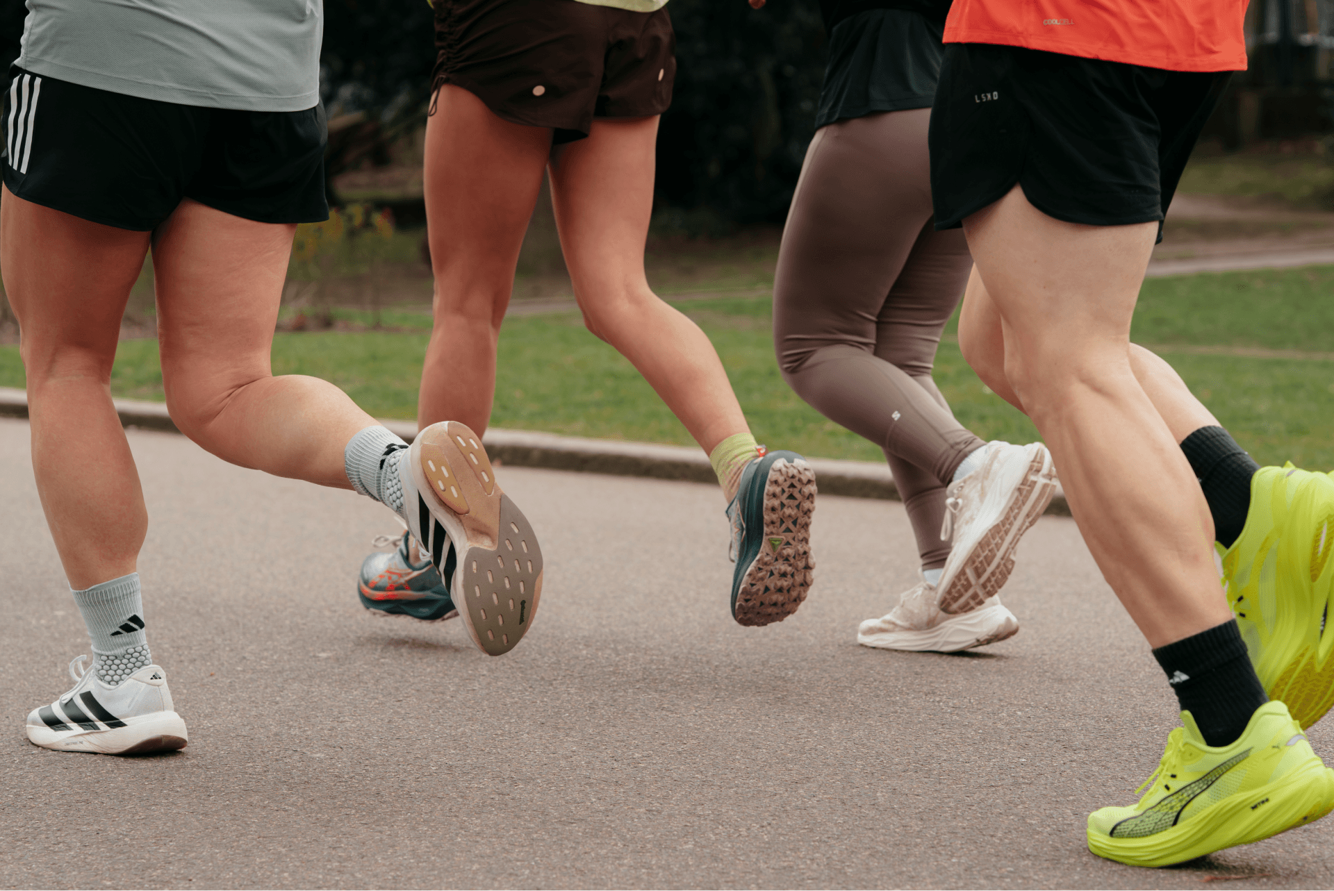 Blurred image of runners' legs mid-race