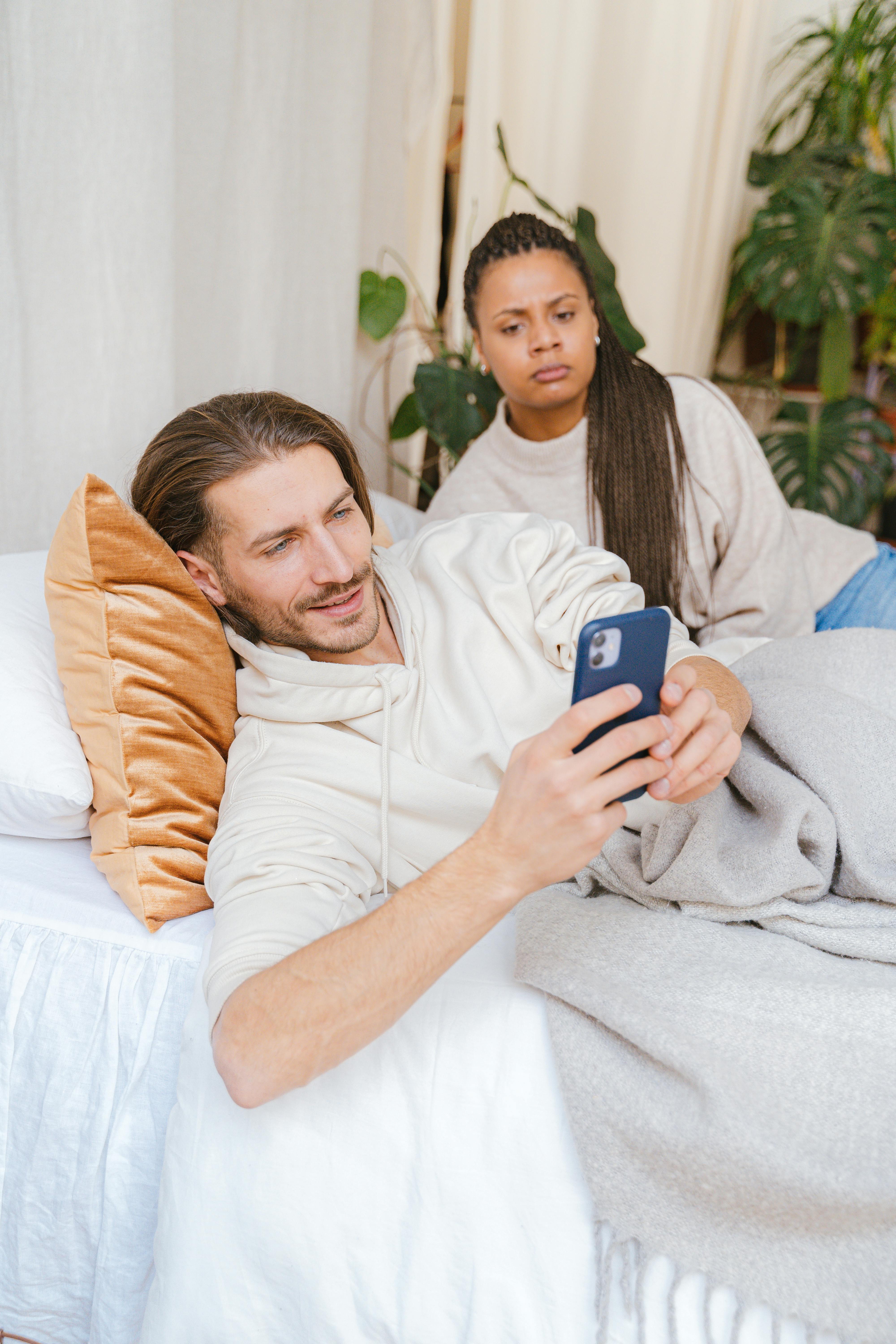 Couple experiencing trust issues due to dating app suspicions