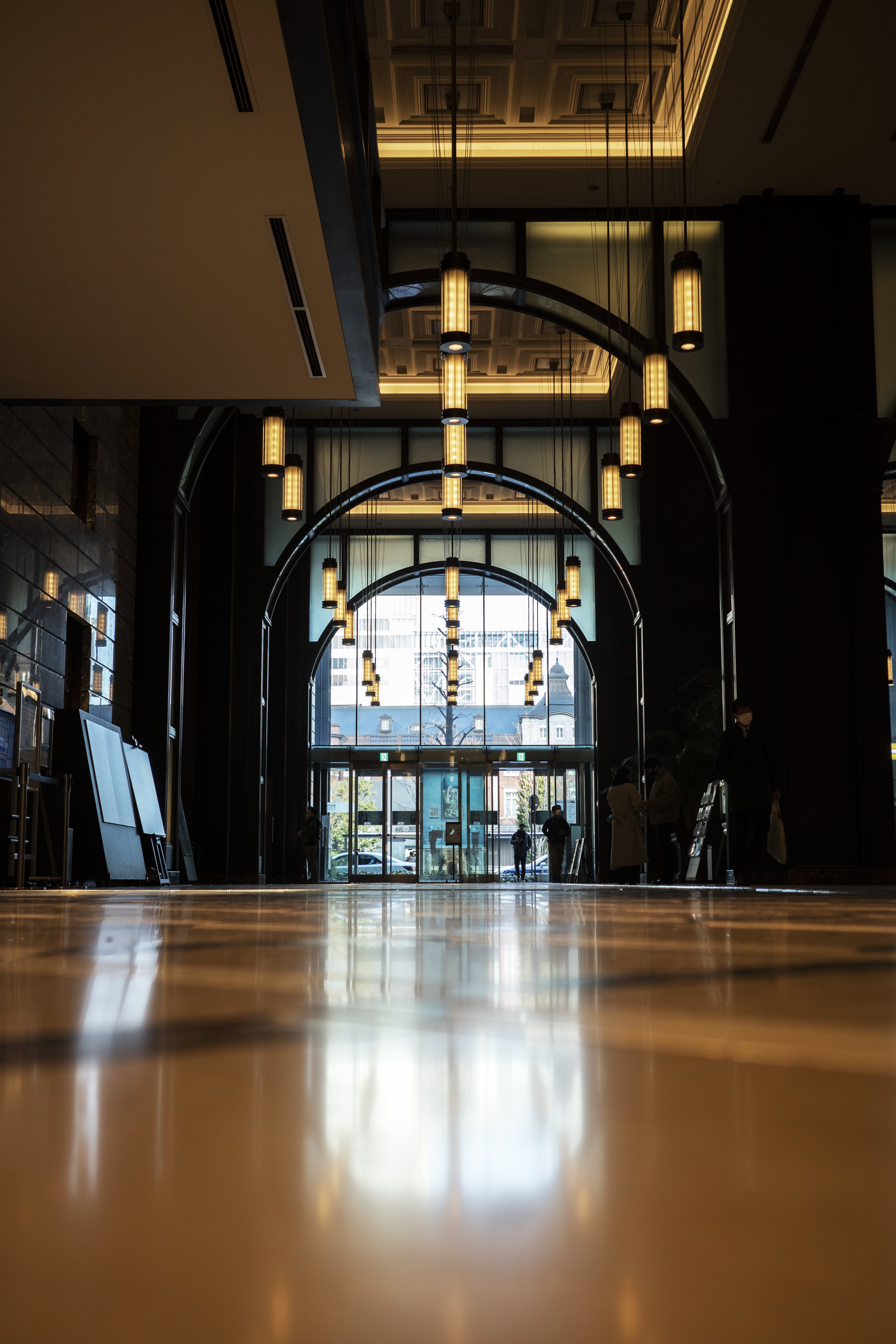 A luxury boutique hotel lobby with modern lighting and architecture