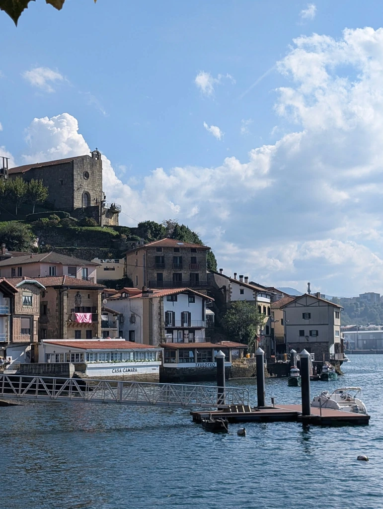 Waterfront houses, Casa Cámara restaurant and boats in Pasaia harbor