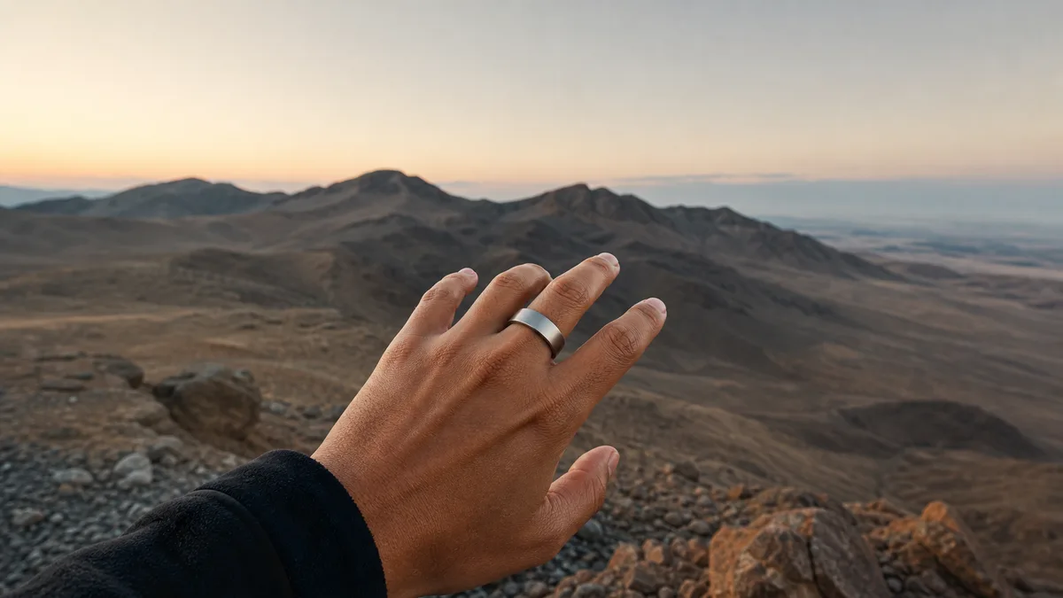 Smart tasbih ring on a hand overlooking an empty wilderness with no phone or signal towers