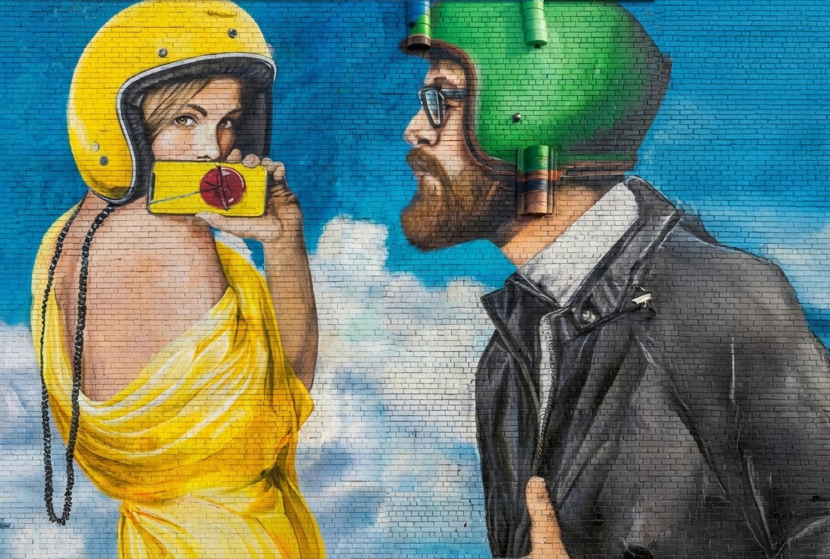 Stack of modern books and magazine with minimalist cover design on leather chair