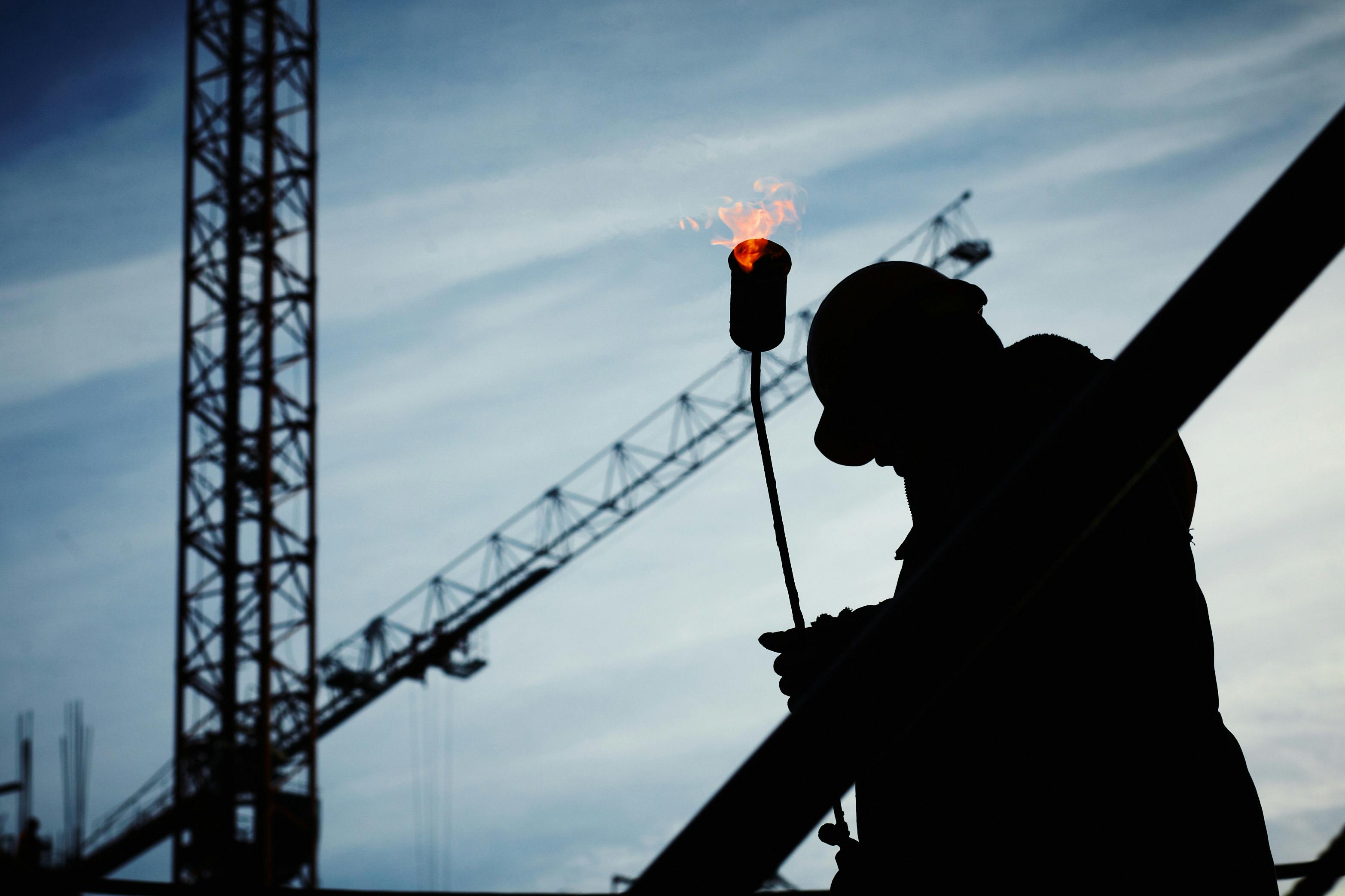 a large piece of metal being poured into a container