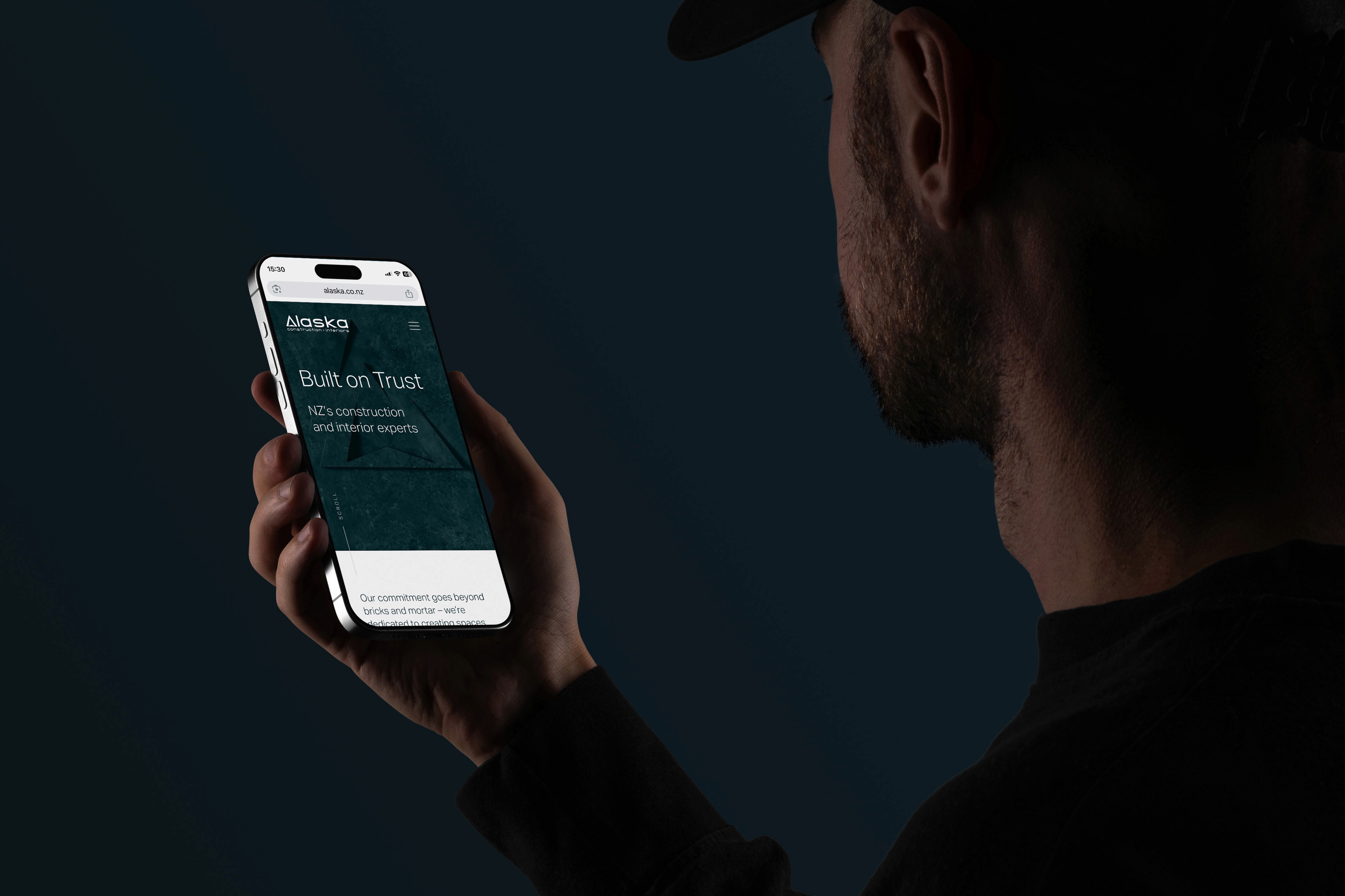 Alaska website being looked at by young professional on phone